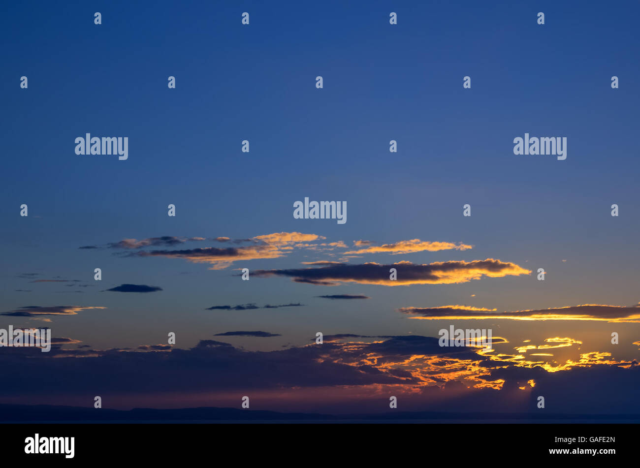 Clouds at dusk Stock Photo - Alamy