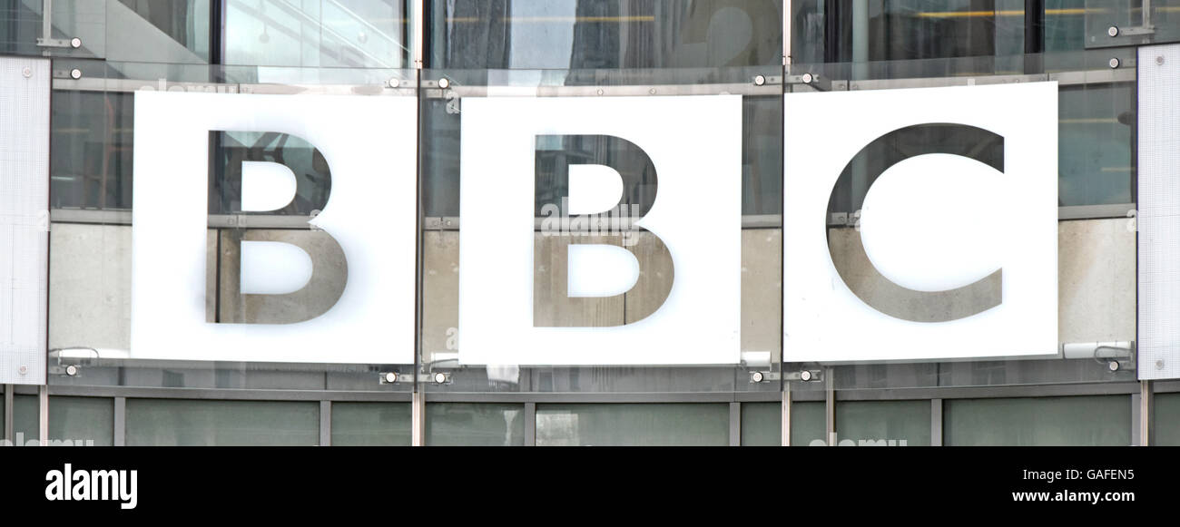 Close up of BBC logo on the glazed cladding of the recent extension to the original Broadcasting House Stock Photo