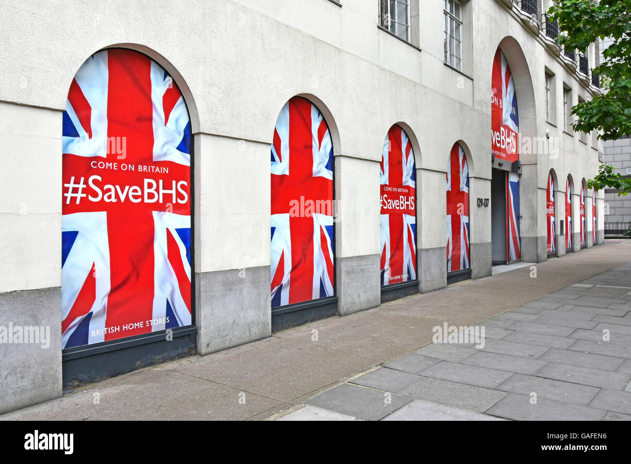 Union Jack Flag designs in windows & entrance at British Home Stores HQ office building in London during its campaign to avoid liquidation closure UK Stock Photo