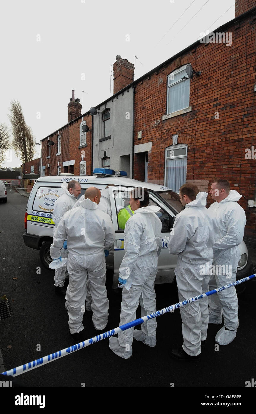 Police forensic teams at the house in Wakefield where Archie-Lee Hirst was killed by a dog. Stock Photo