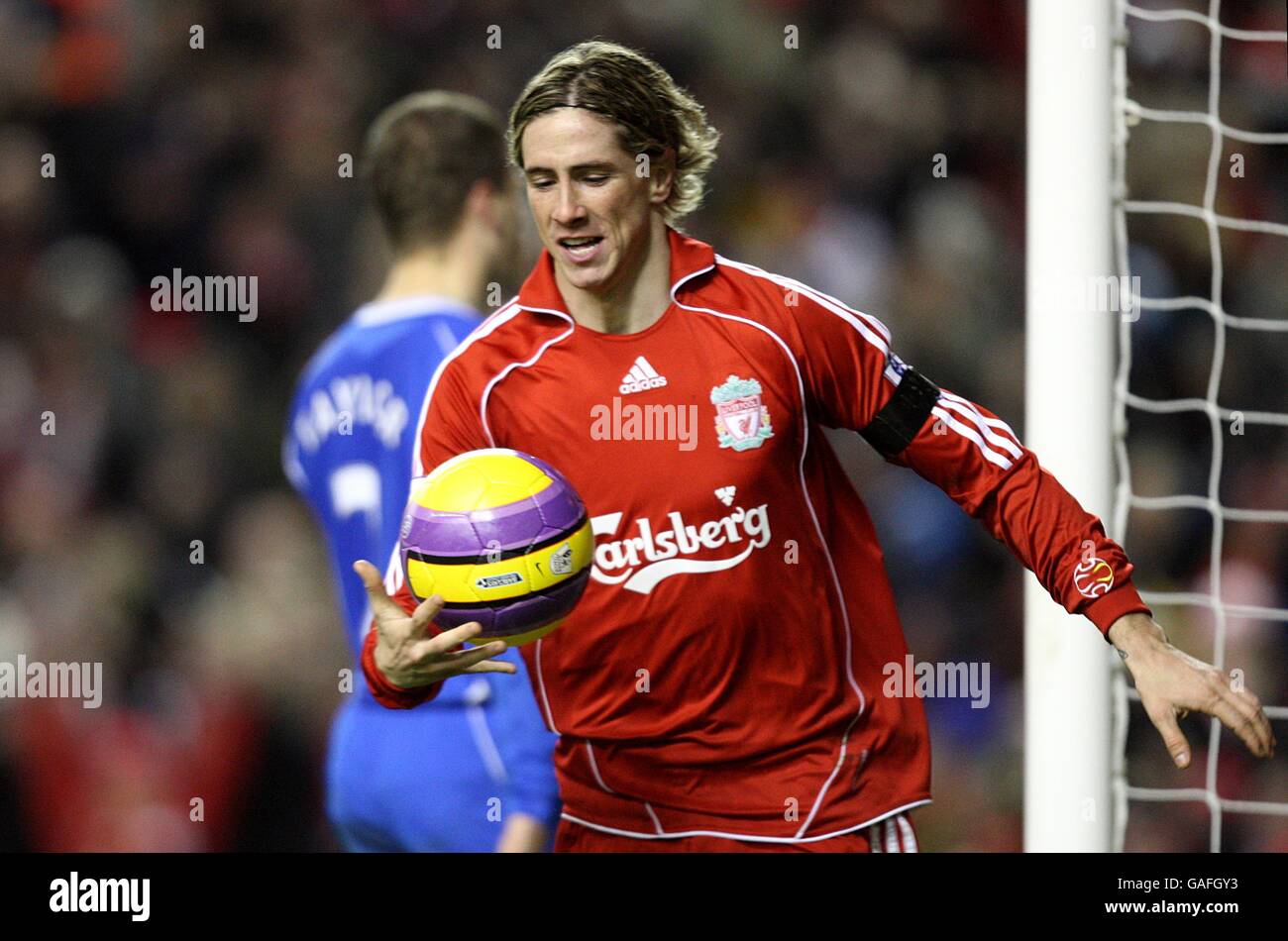 Soccer - Barclays Premier League - Liverpool v Wigan Athletic - Anfield. Liverpool's Fernando Torres grabs the ball in celebration after scoring the first goal of the game. Stock Photo