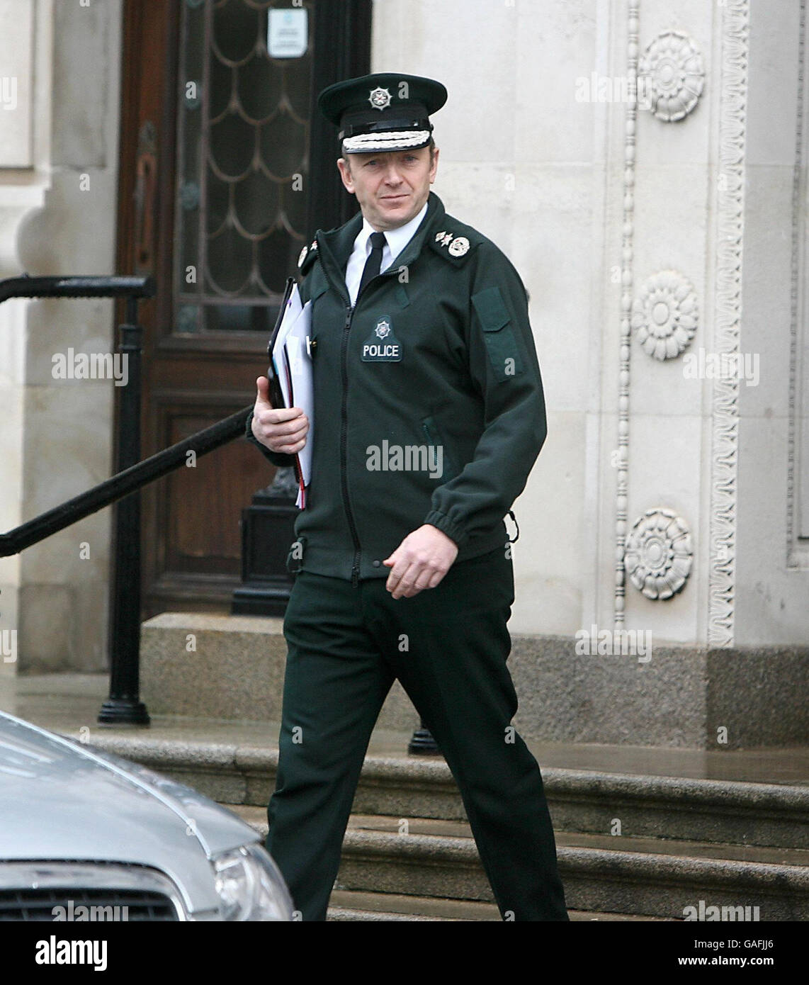 PSNI chief constable Sir Hugh Orde leaves the Parliament Buildings in Belfast. He today warned a Stormont committee that the police in Northern Ireland may reach a tipping point over the resources they can allocate to looking into unsolved murders from the past. Stock Photo