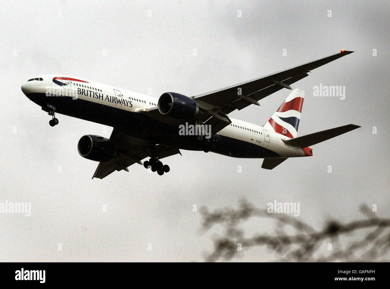 A British Airways Boeing 777 approaches touchdown at Heathrow Airport west of central London, where a similar Aircraft landed short of the Southern runway this afternoon. Stock Photo