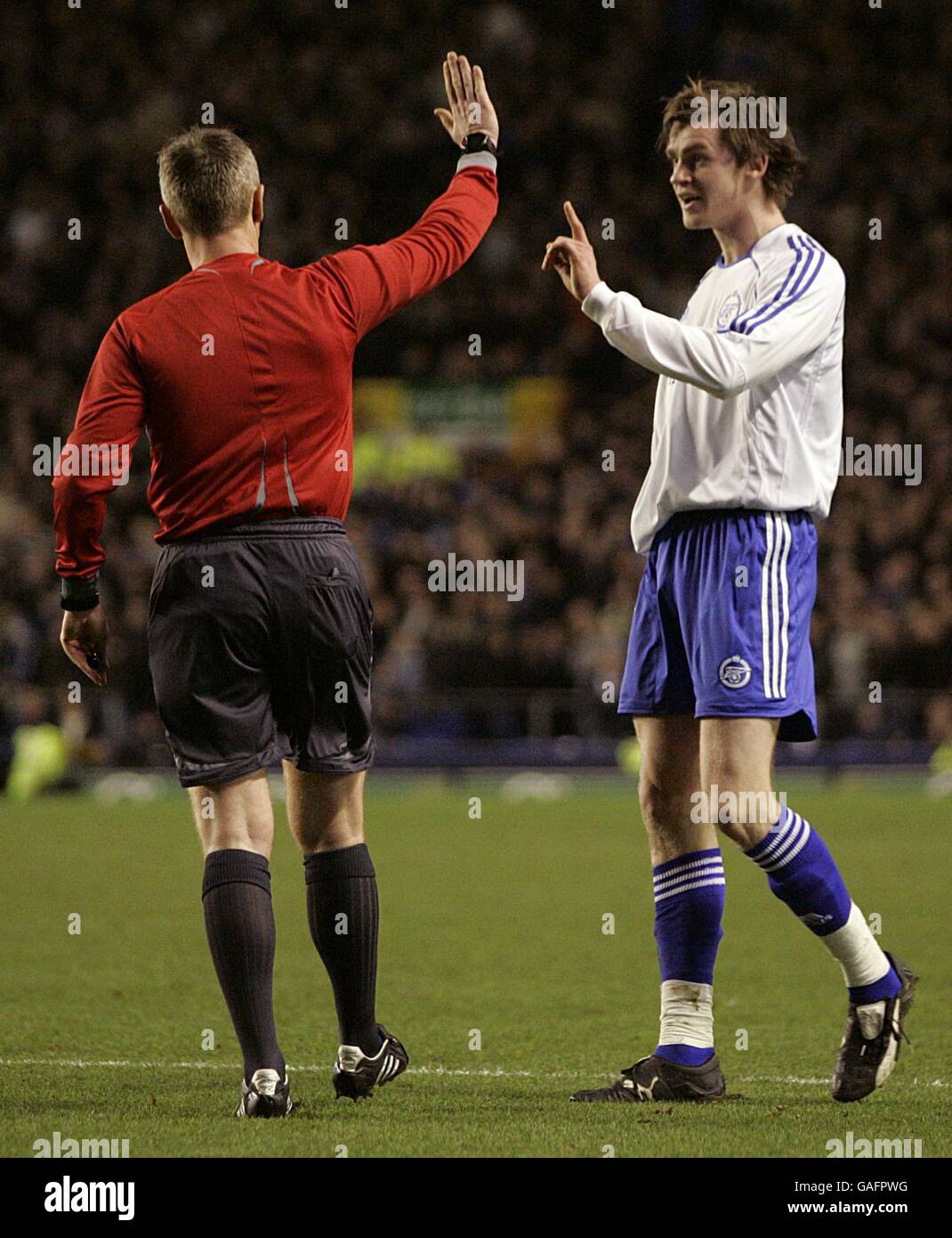 Zenit St Petersburg's Nicolas Lombaerts (right) protests with referee Kristinn Jakobsson after being sent off for handball. Stock Photo