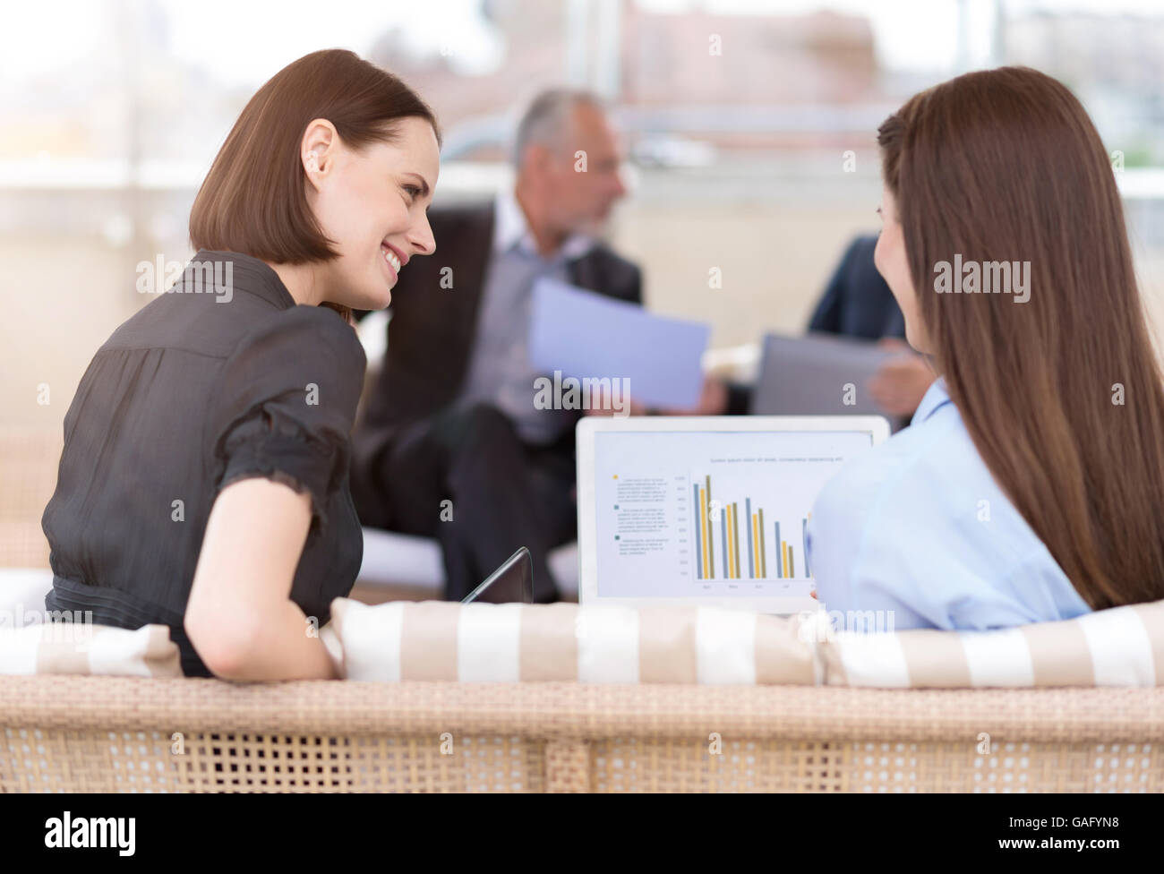 Positive Discussuin Positive colleagues discussing project Stock Photo - Alamy