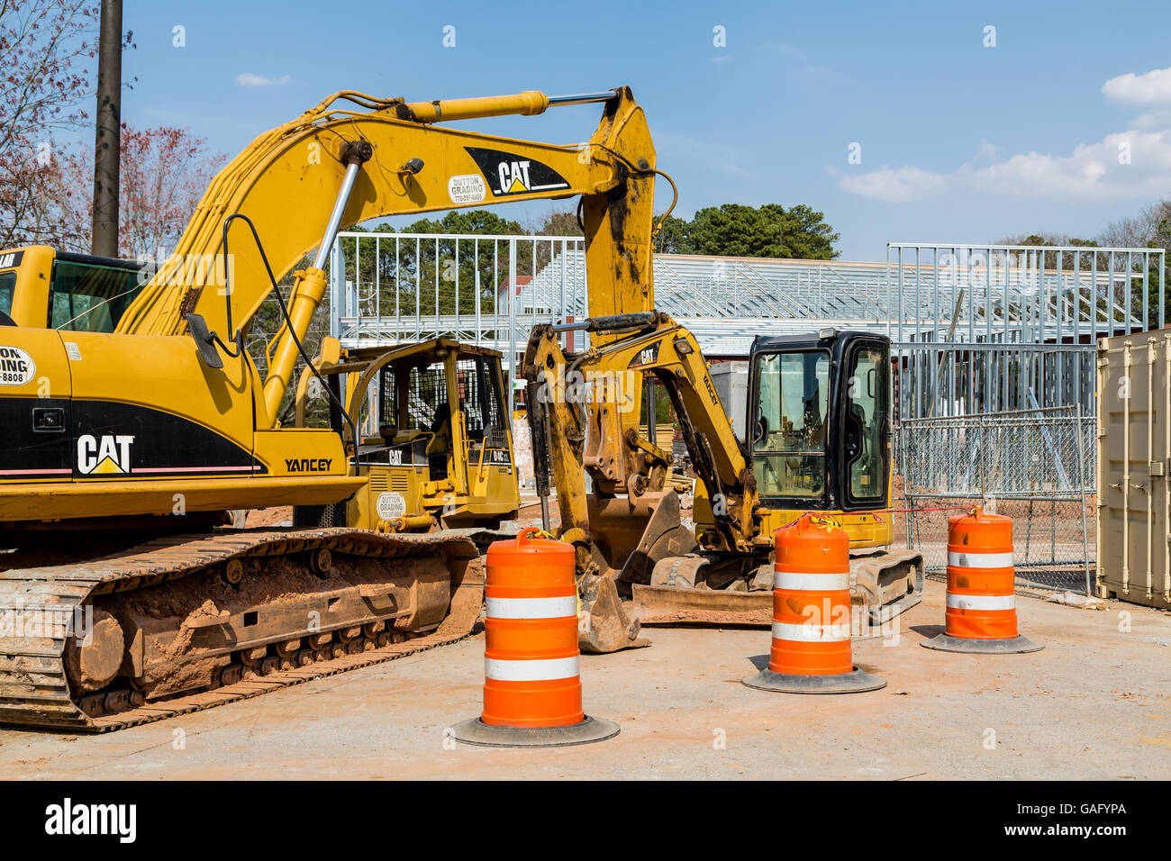 Front End Loader and Barrels at construction site Stock Photo Alamy