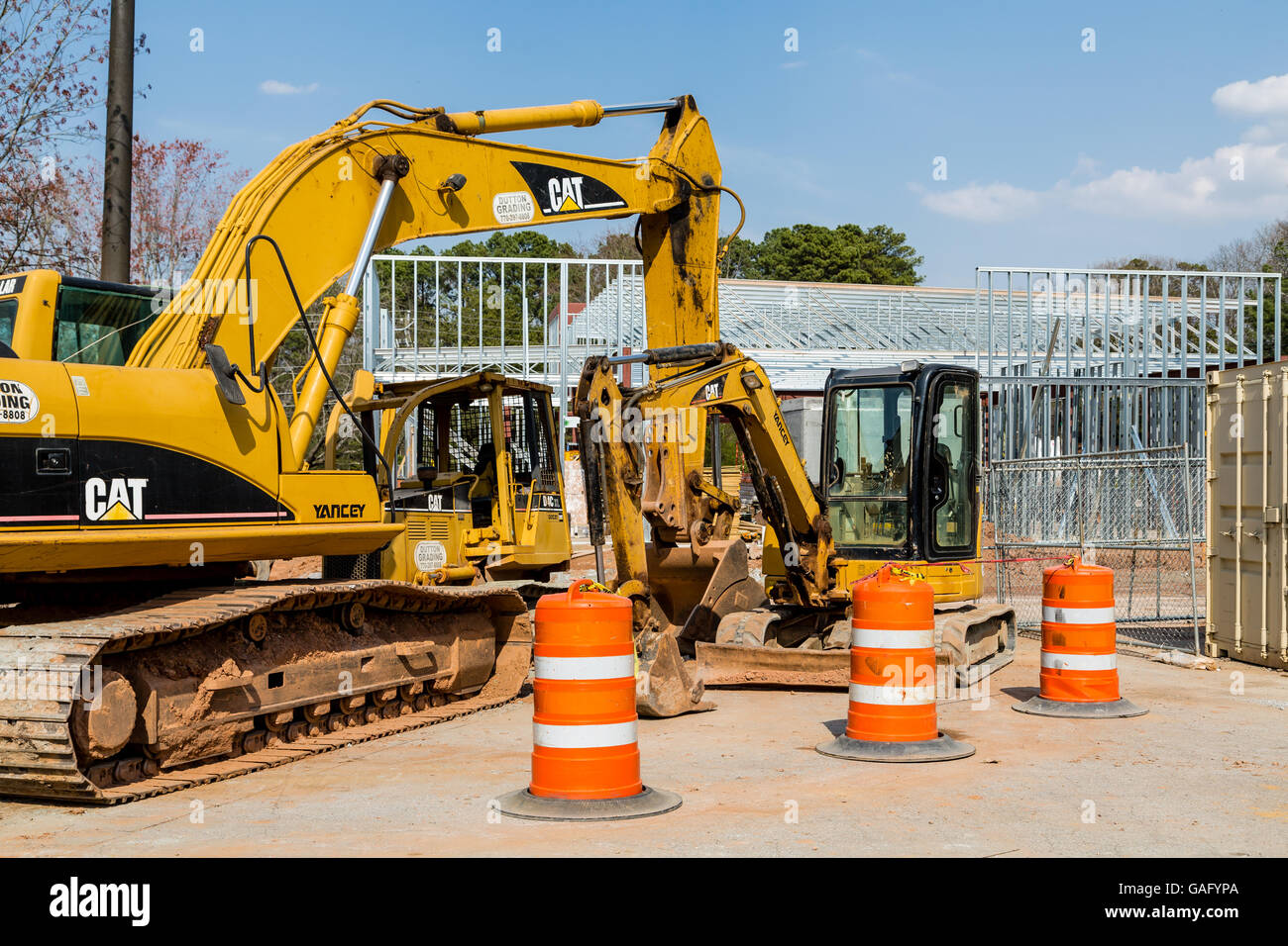 Front End Loader and Barrels at construction site Stock Photo