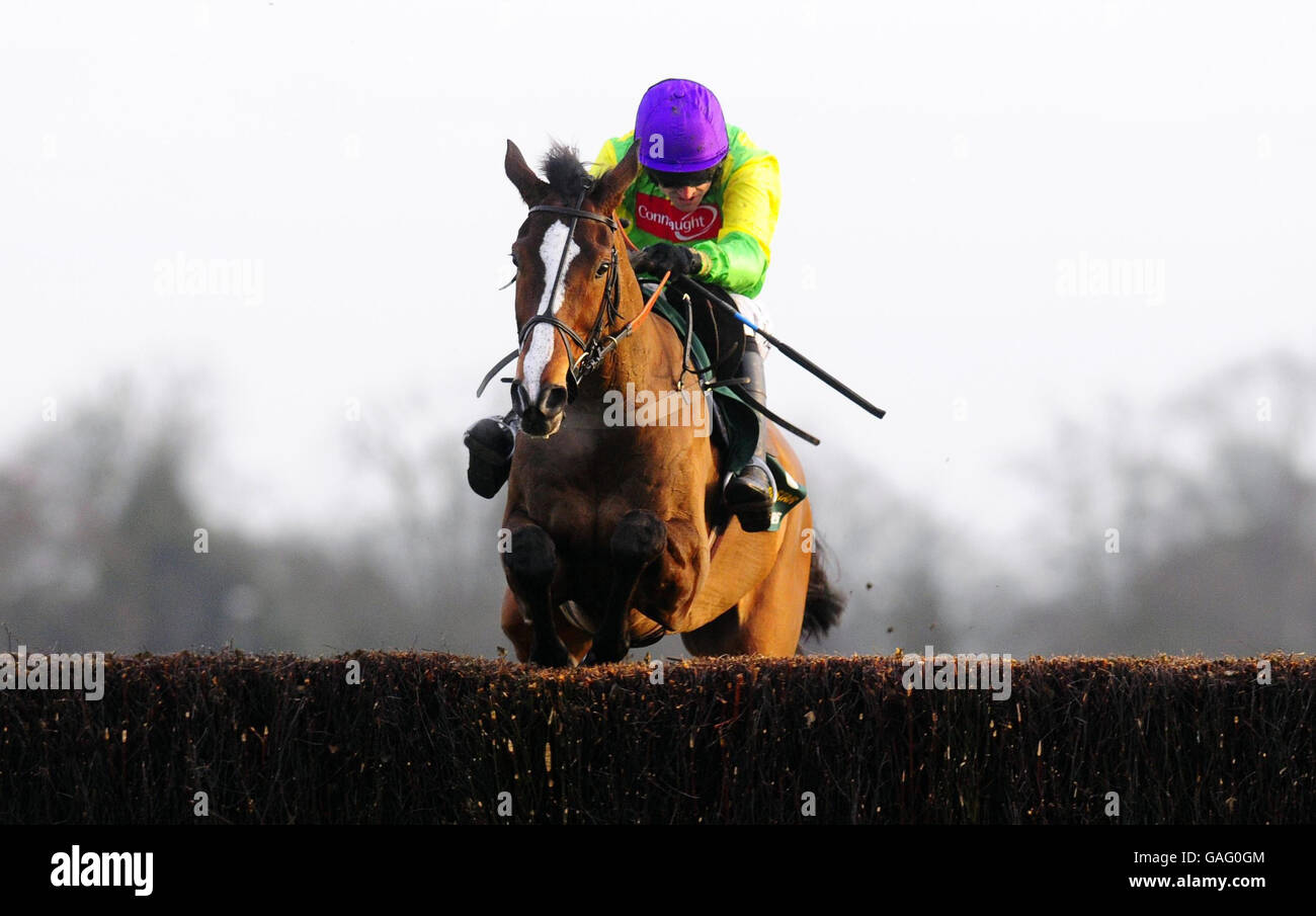 Kauto Star ridden by Ruby Walsh jump the last to win The Stan James King George VI Chase at Kempton Park Racecourse. Stock Photo