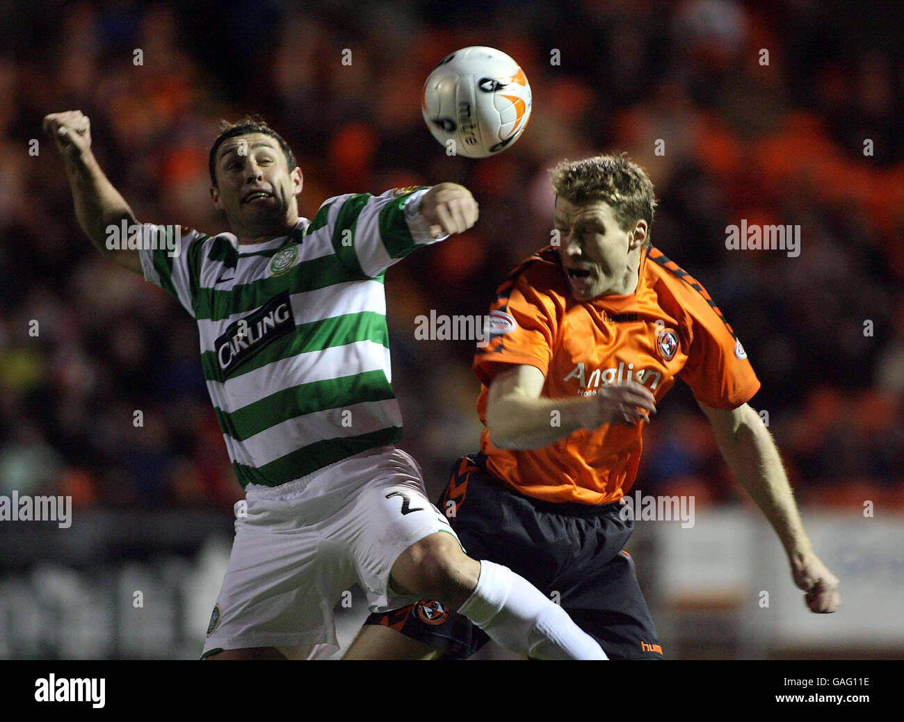 Celtic's Scott McDonald in action with Dundee United's Darren Dods during the Clydesdale Bank Scottish Premier League match at Tannadice Park, Dundee. Stock Photo