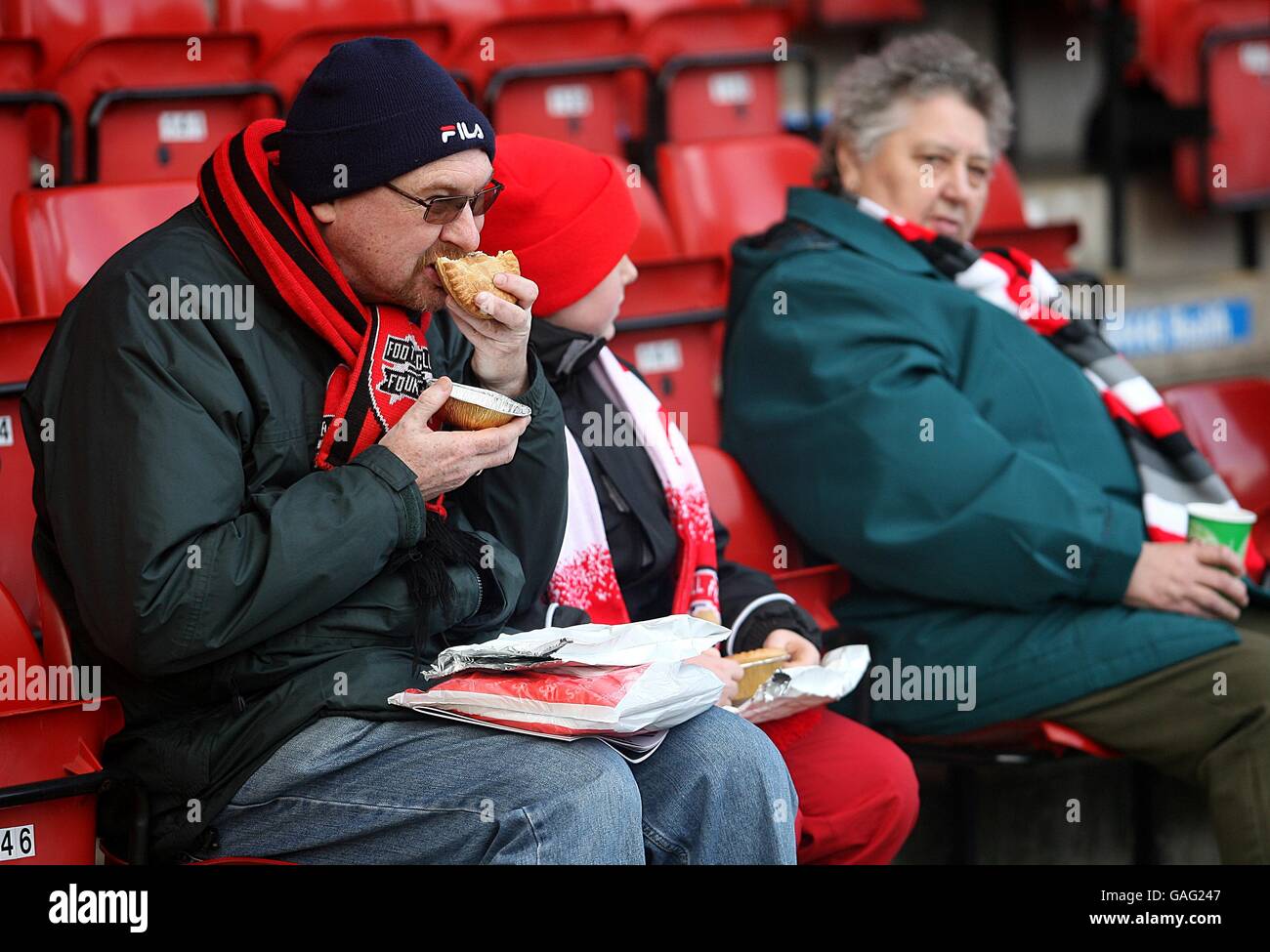 Soccer - FA Cup - Third Round - Walsall v Millwall - Banks' Stadium. A Walsall enjoys a pre match pie Stock Photo