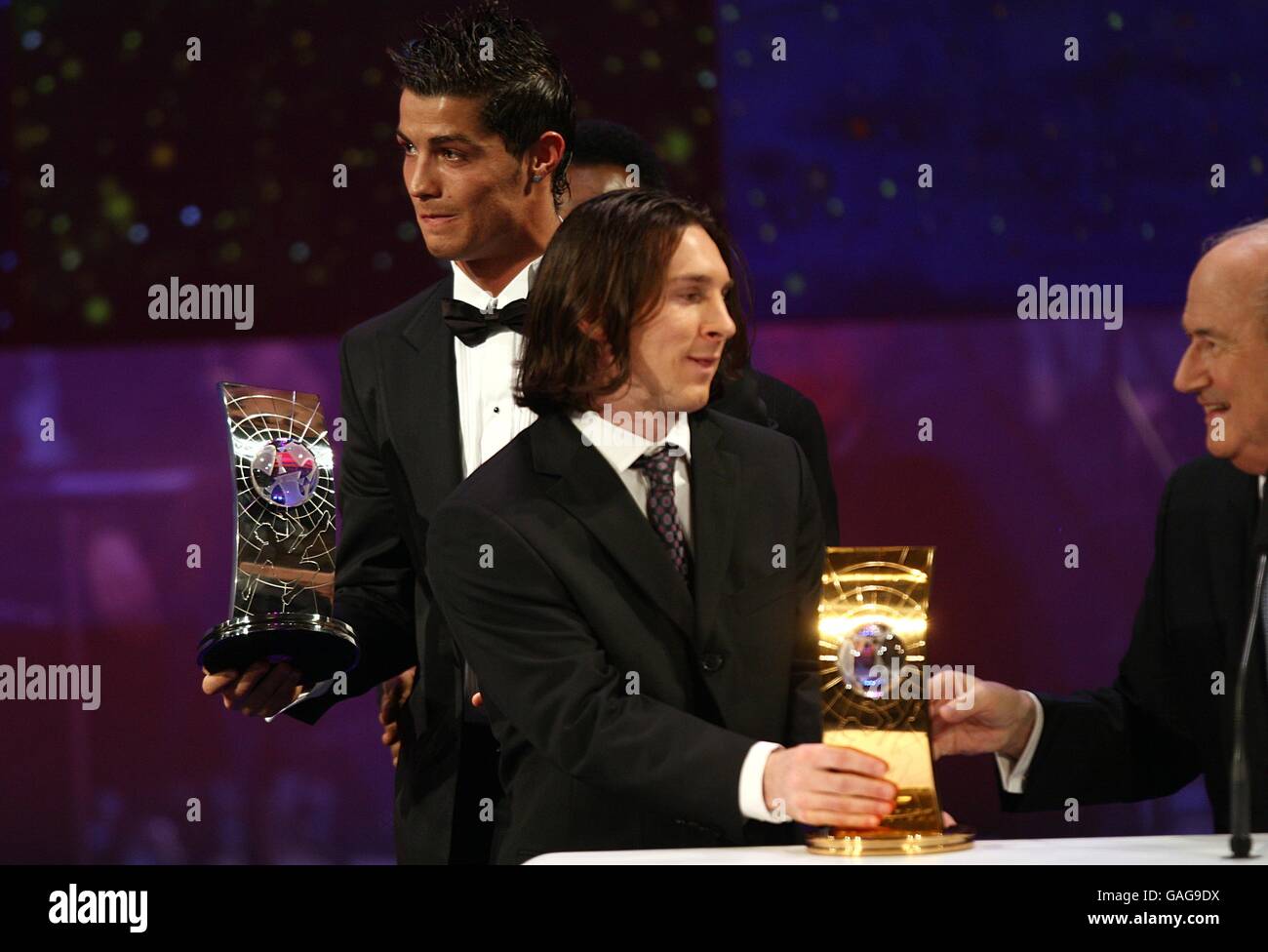 Barcelona's Lionel Messi is handed the wrong trophy after being named runner up in the FIFA World Player of the Year award at the FIFA World Player Gala Stock Photo