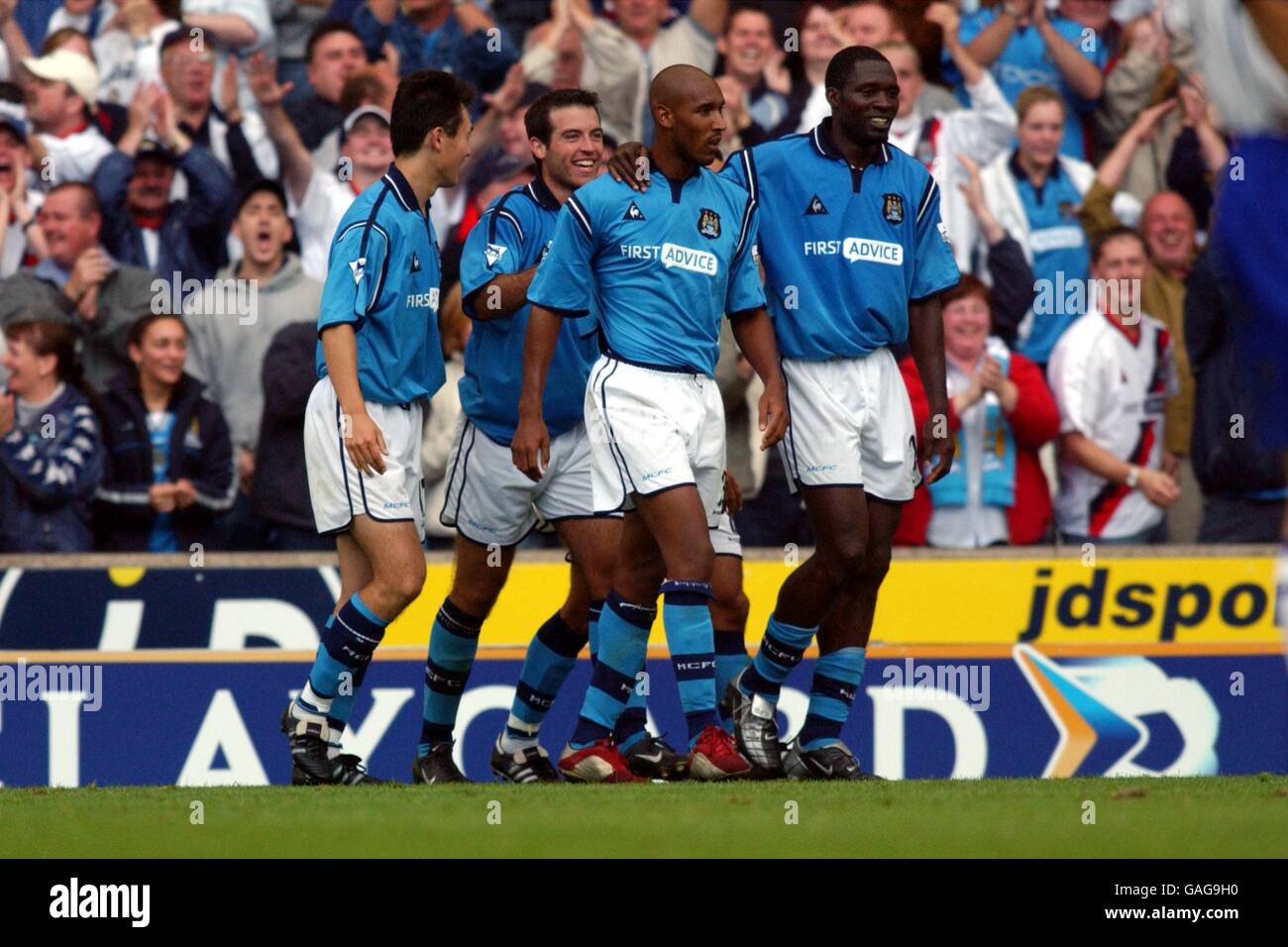 Soccer - FA Barclaycard Premiership - Manchester City v Everton. Manchester City players surround their teammate Nicolas Anelka in celebration as he completes his hat trick Stock Photo