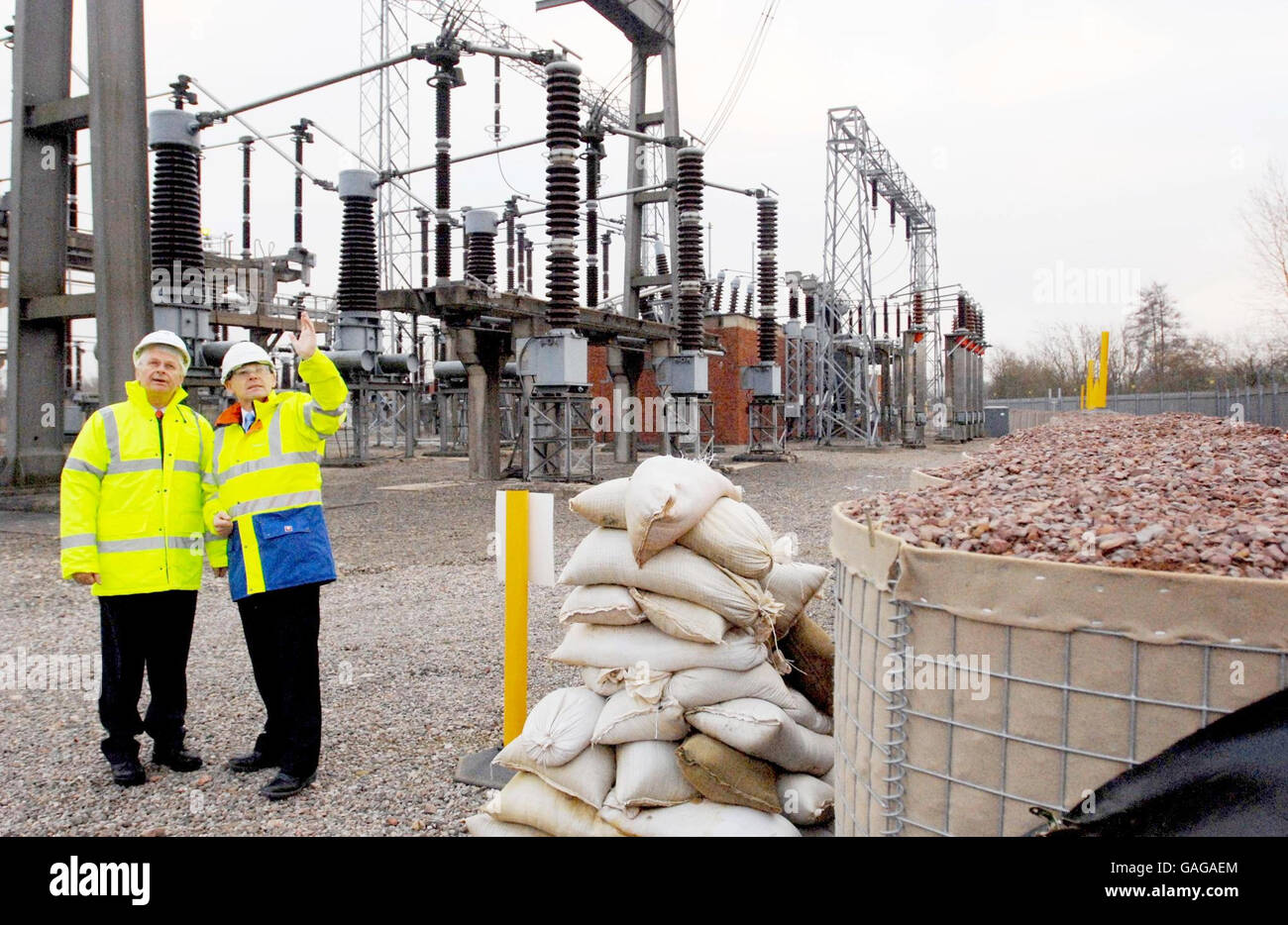 Sir Michael Pitt inspects new barrier at the Walham Electricity Substation Stock Photo