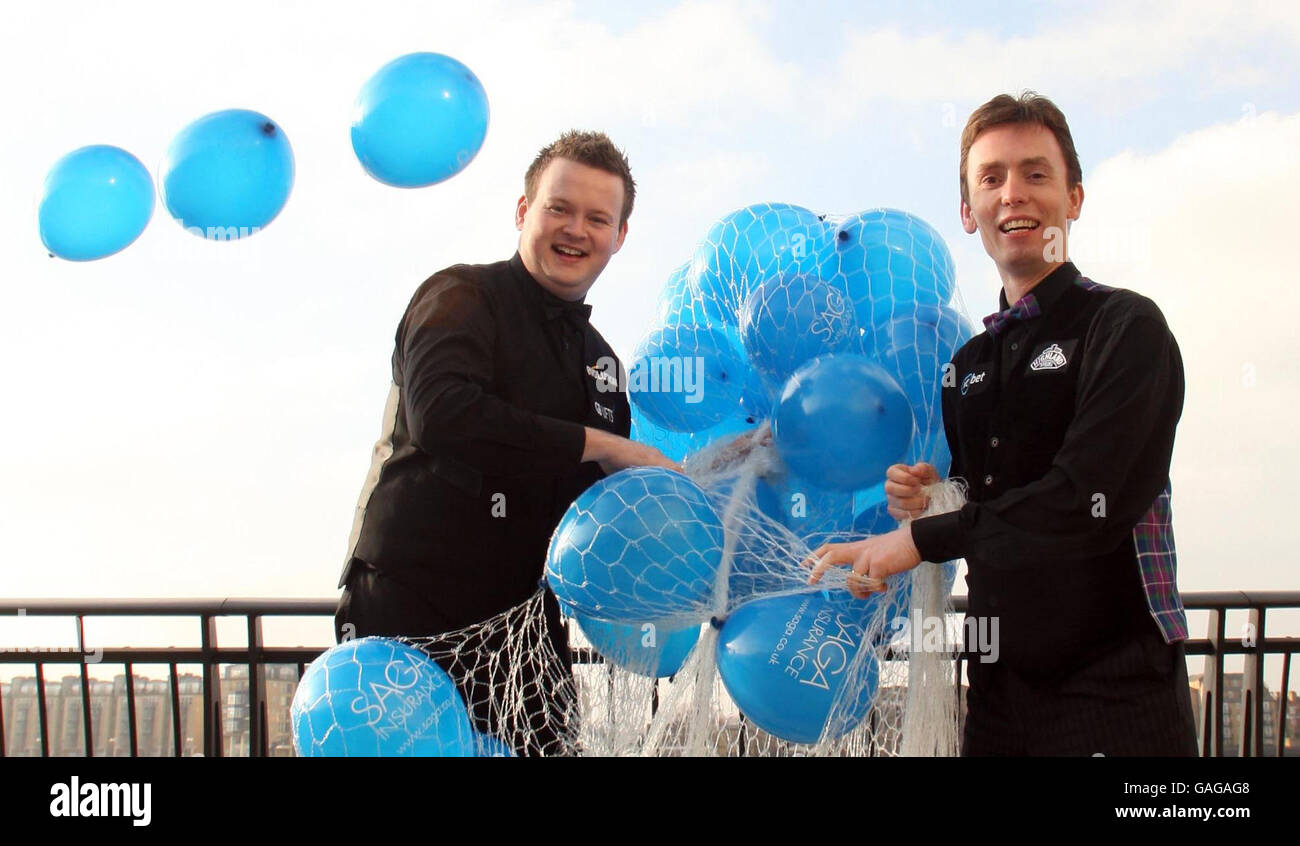 Snooker players Ken Doherty (right) and Shaun Murphy launch the SAGA Insurance Masters by releasing 200 balloons in Canary Wharf, London. Stock Photo