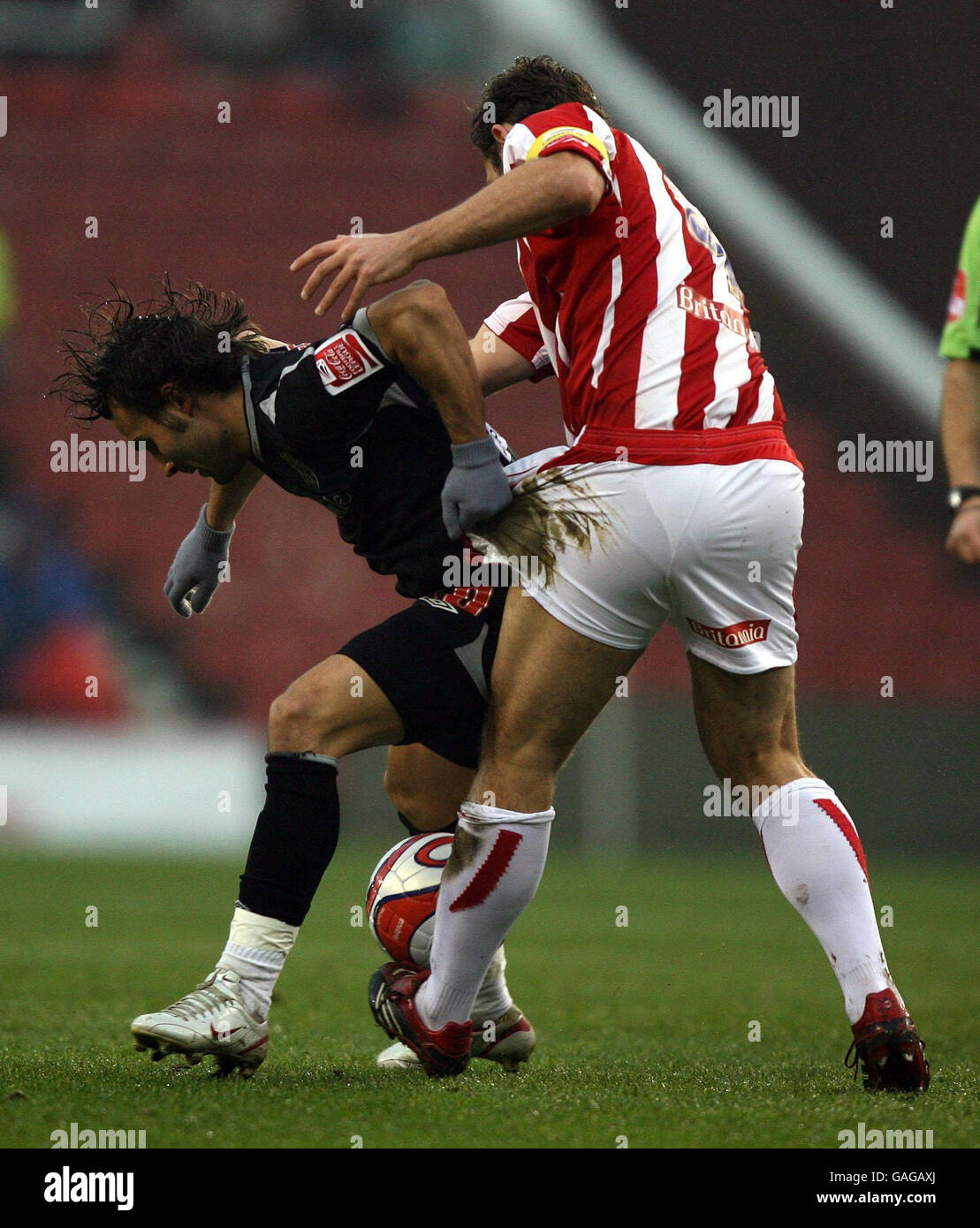 Stoke City's John Eustace and West Bromwich Albion's Filipe Teixeira tussle during the Coca-Cola Football League Championship match at the Britannia Stadium, Stoke-on-Trent. Stock Photo