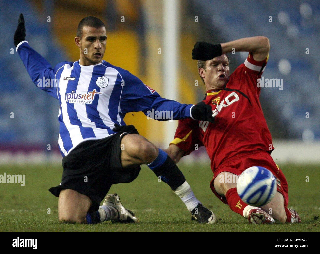 Sheffield Wednesday's Marcus Tudgay and Watford's Jay DeMerit in action during the Coca-Cola Football League Championship match at Hillsborough, Sheffield. Stock Photo