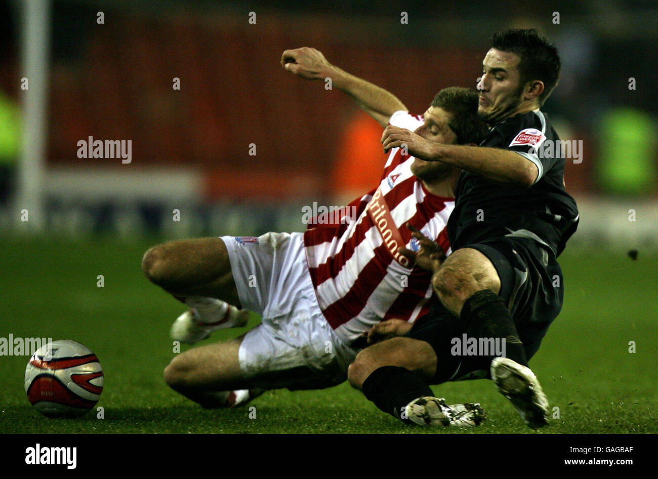 Stoke City's Richard Cresswell and West Bromwich Albion's Carl Hoefkens tussle during the Coca-Cola Football League Championship match at the Britannia Stadium, Stoke-on-Trent. Stock Photo