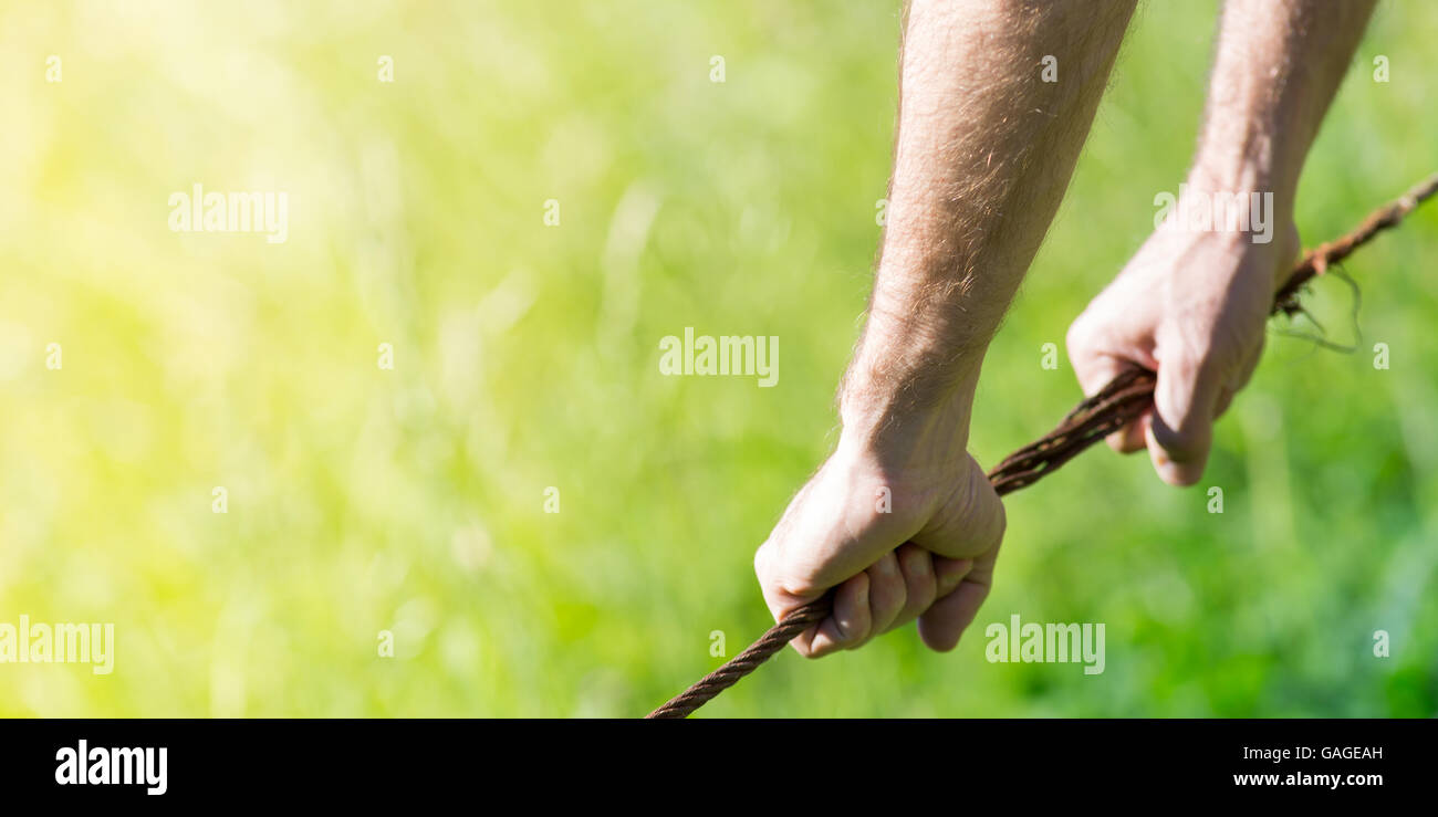Prison and border metaphors, on a green background Stock Photo