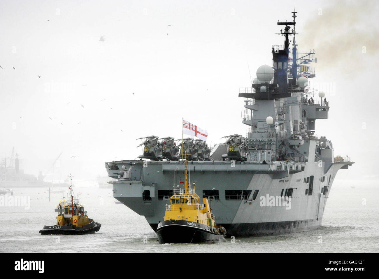 The Royal Navy aircraft carrier HMS Illustrious returns to Portsmouth just two days after she left to start a four month tour of the Indian Ocean. A naval spokesman said a fault with a meat refrigerator forced the vessel home for repairs. Stock Photo