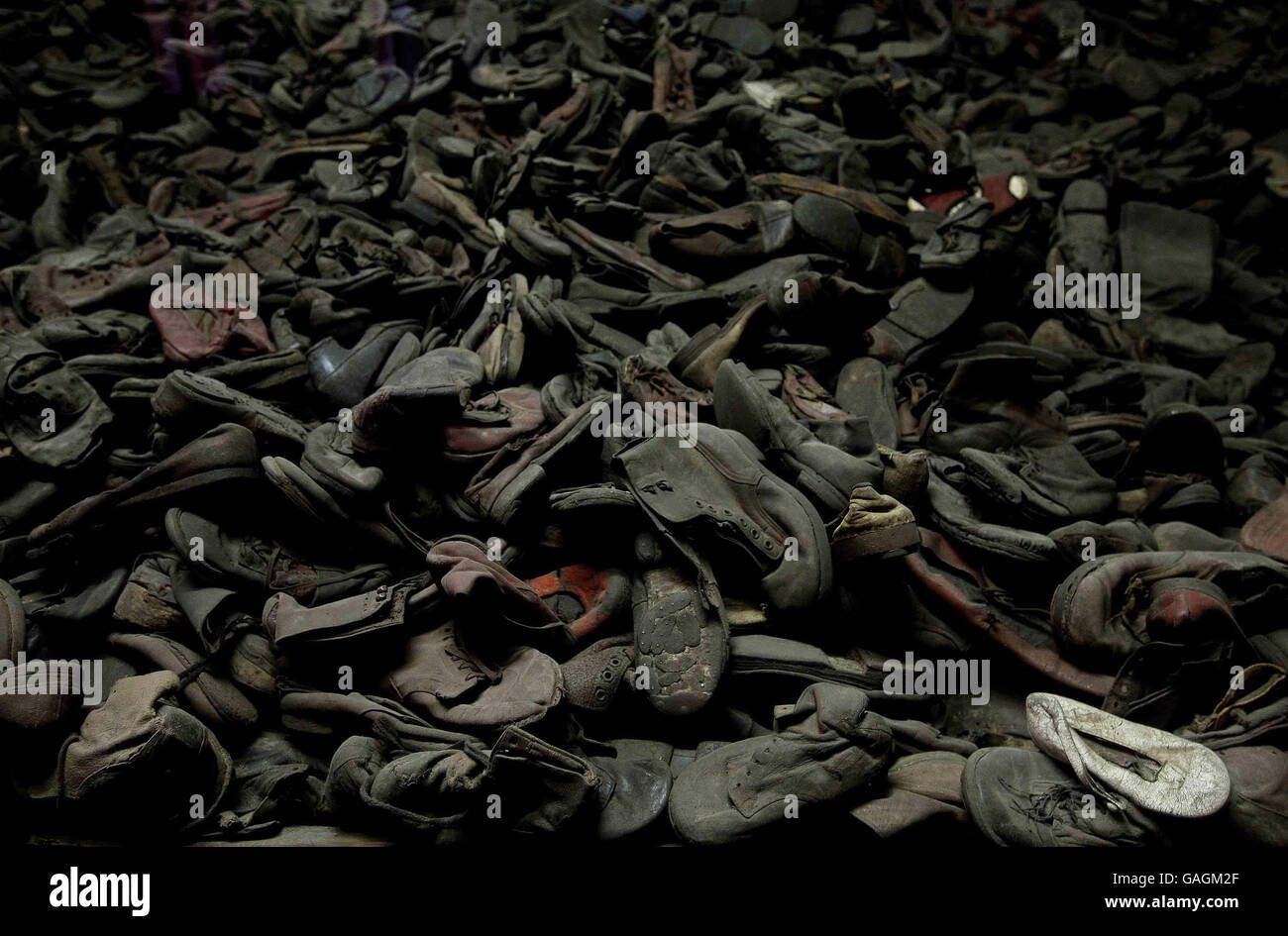 A single child's white shoe stands out amongst around 30 thousand shoes at the former Auschwitz I camp. Sunday January 27th is International Holocaust Memorial Day which marks the date when Auschwitz was liberated. Stock Photo