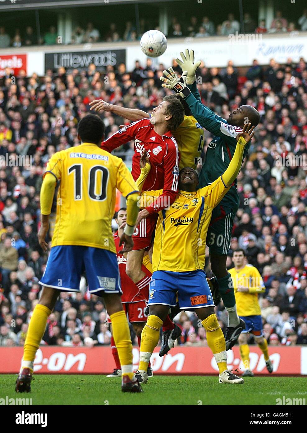 Soccer - FA Cup - Fourth Round - Liverpool v Havant and Waterlooville - Anfield. Liverpool goal keeper Charles Itandje (right) comes out to catch the ball. Stock Photo