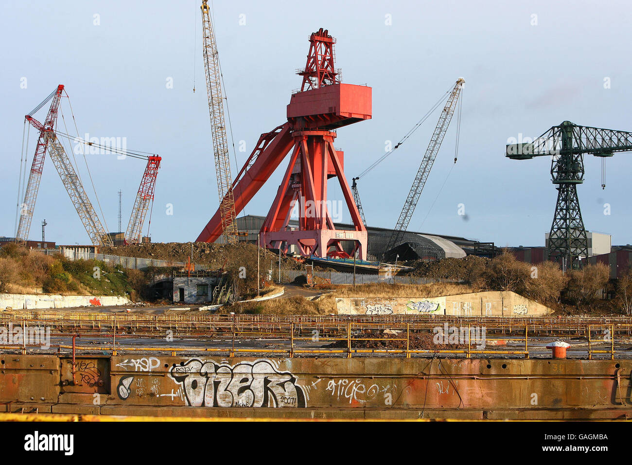 The famous Swan Hunter's cranes lie half dismantled at the dormant shipyard once famous for employing 1000 of workers on the River Tyne. Stock Photo