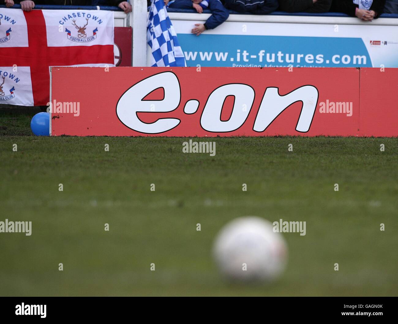 Advertising board showing official FA Cup sponsors e.on at Chasetown's  Scholars ground Stock Photo - Alamy