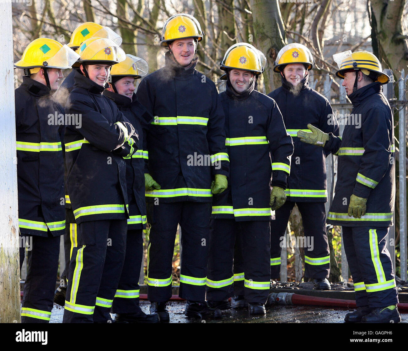 Fireman Trainee Some of the eighteen new trainee firefighters at a graduation ceremony ...
