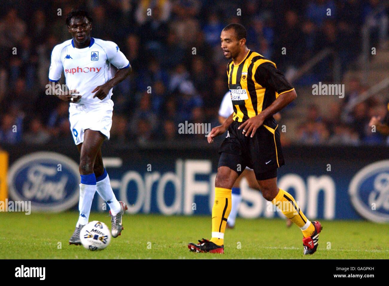 AEK Athens' Mauricio Wright (r) takes the ball forward as RC Genk's  Beli-Moumouni Dagano (l) looks on Stock Photo - Alamy