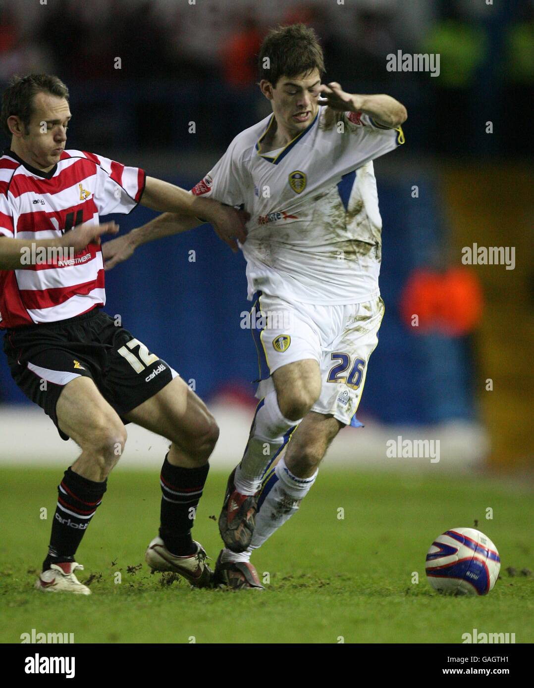 Doncaster Rovers' James Hayter and Leeds United's Ben Parker battle for the ball Stock Photo