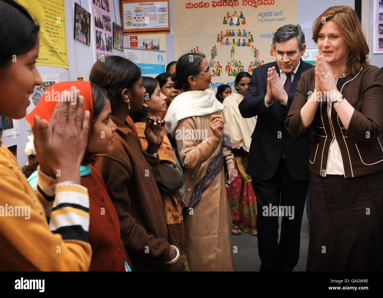 Prime Minister Gordon Brown and his wife Sarah meet women from the Mahila Samalchya Women's Empowerment Project in Delhi today with the traditional Indian greeting Namaste. He is on the second leg of his most far-flung diplomatic mission since taking over at Number 10. Stock Photo