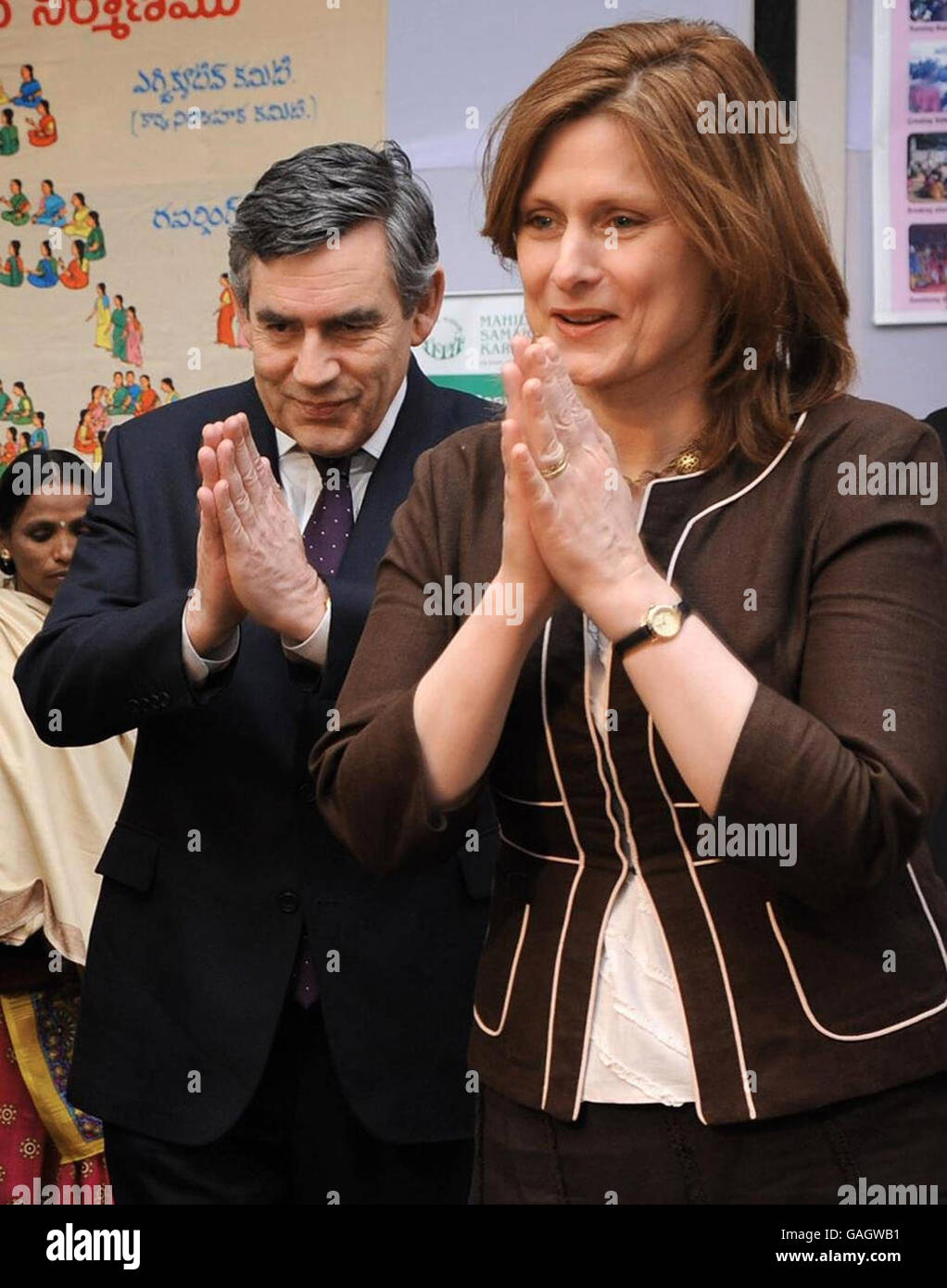 PLEASE NOTE ALTERNATE CROP. Prime Minister Gordon Brown and his wife Sarah meet women from the Mahila Samalchya Women's Empowerment Project in Delhi today with the traditional Indian greeting Namaste. He is on the second leg of his most far-flung diplomatic mission since taking over at Number 10. Stock Photo