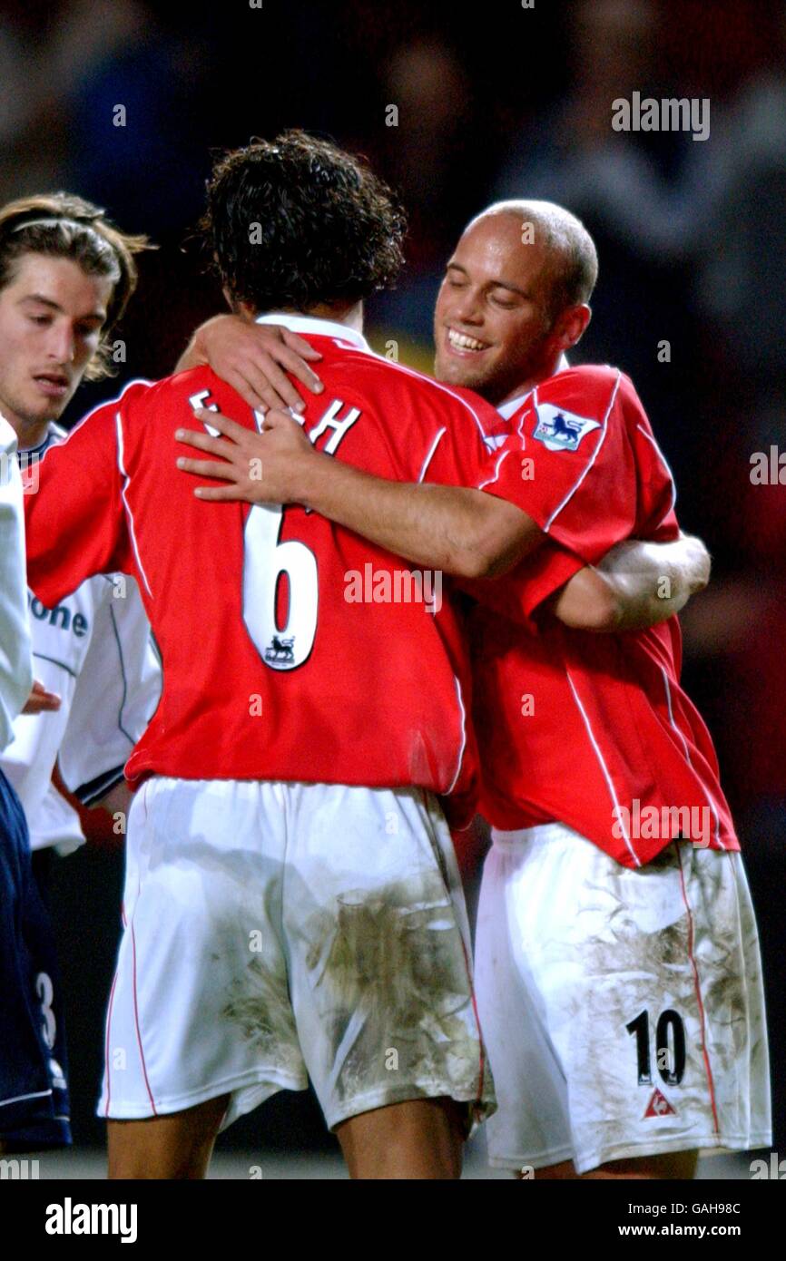 Soccer - FA Barclaycard Premiership - Charlton Athletic v Middlesbrough. Charlton Athletic's Mark Fish (l) and teammate Claus Jensen (r) congratulate eachother after beating Middlesbrough 1 - 0 Stock Photo