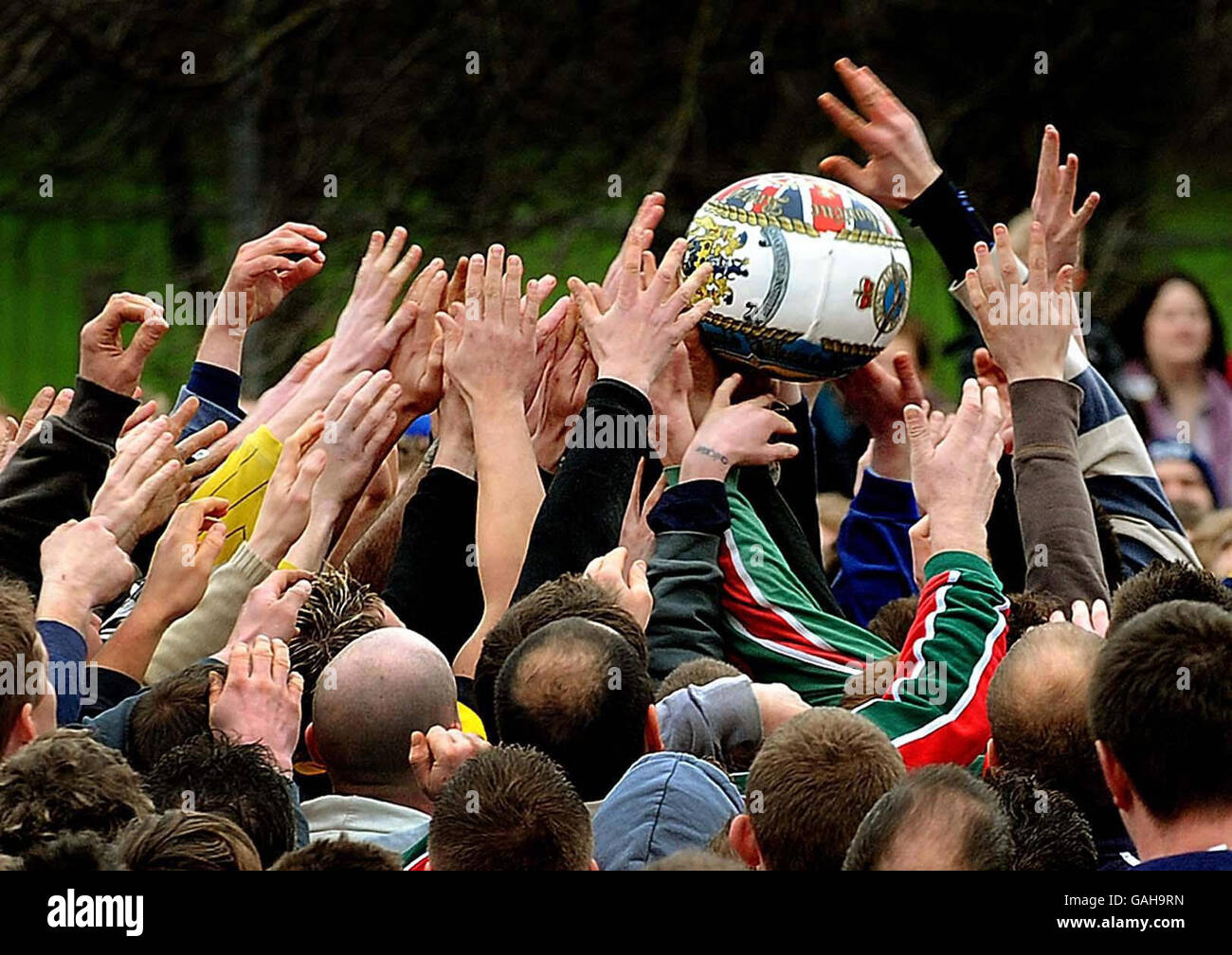 Participants pictured playing in the Ashbourne Shrovetide football match in Ashbourne, Derbyshire. Stock Photo