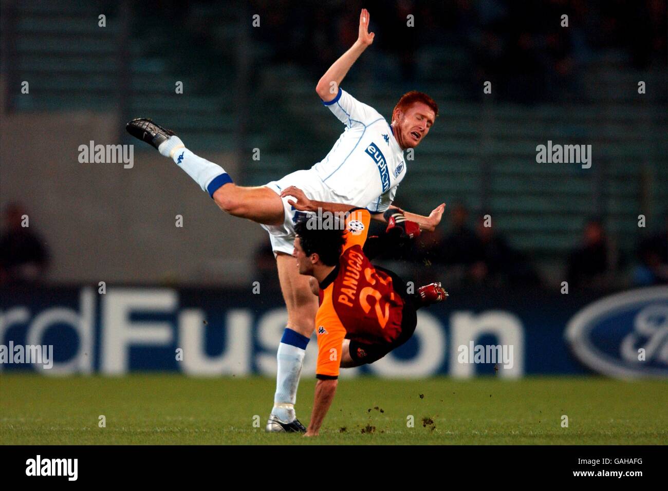 Soccer - UEFA Champions League - Group C - Roma v RC Genk. RC Genk's Bernd Thijs (top) and Roma's Christian Panucci battle for the ball Stock Photo