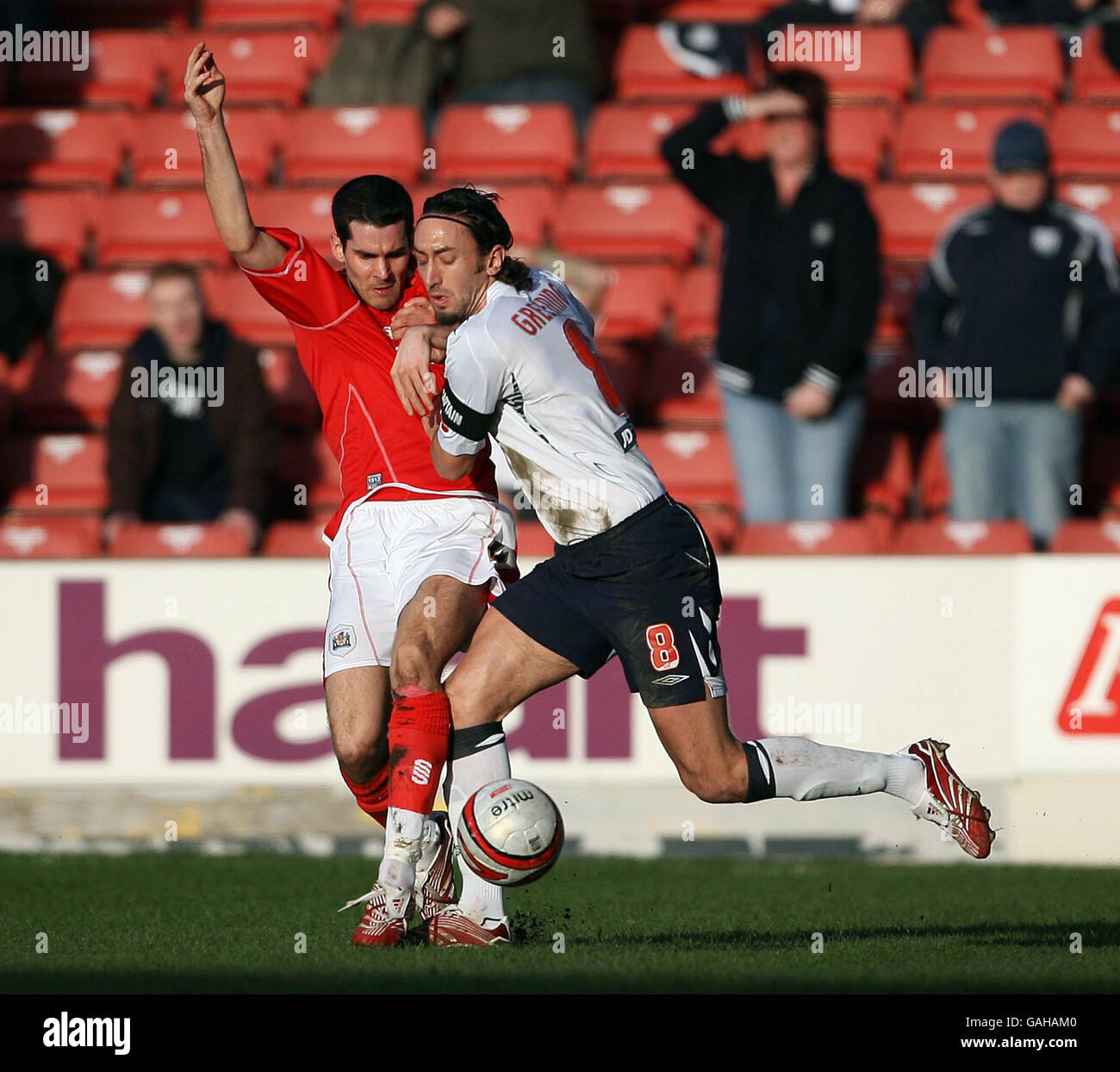 West Bromwich Albion's Jonathan Greening and Barnsley's Daniel Nardiello during the Coca-Cola Championship match at Oakwell, Barnsley. Stock Photo
