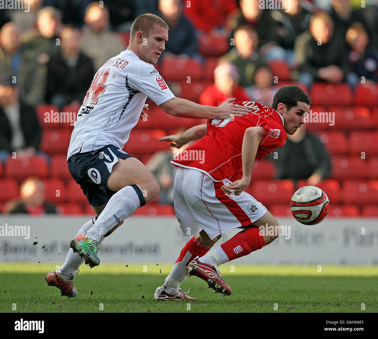 Barnsley's Daniel Nardiello and West Bromwich Albion's Martin Albrechtsen tussle during the Coca-Cola Championship match at Oakwell, Barnsley. Stock Photo