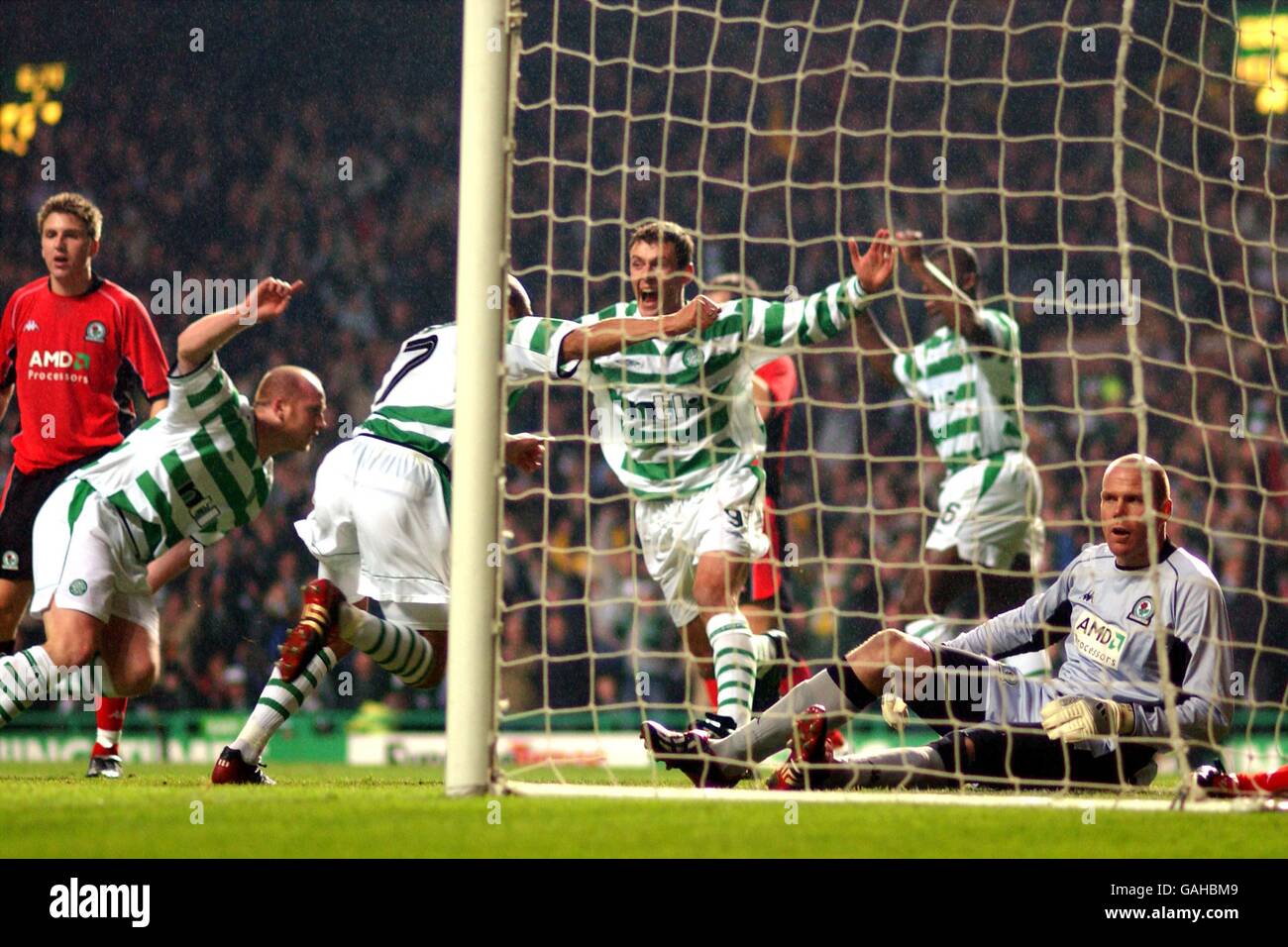 Celtic's Henrik Larsson celebrates (centre) scoring their winning goal