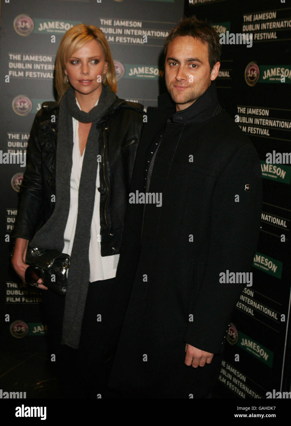Stuart Townsend and Charlize Theron arrive at The Jameson Dublin International Film Festival held at the Savoy Cinema, O'Connell St, Dublin for a special screening of the movie Battle In Seattle. Stock Photo
