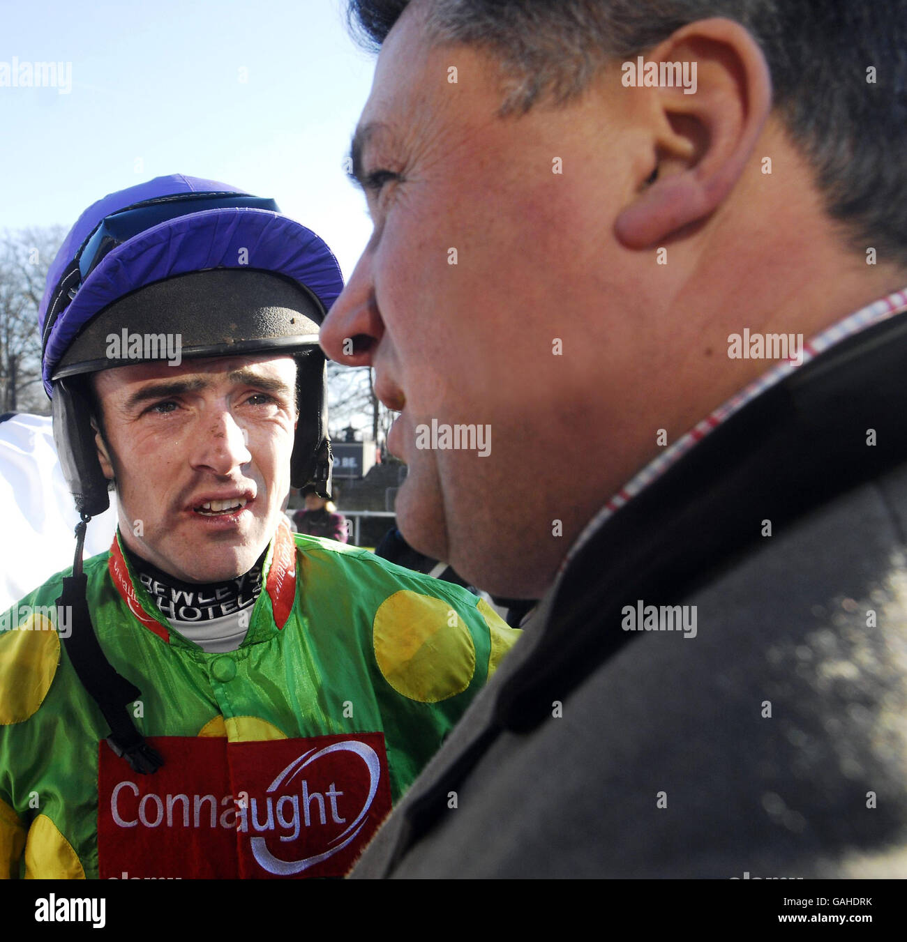Jockey Ruby Walsh talks to trainer Paul Nicholls after victory on Kauto Star in The Commercial First Ascot Steeple Chase at Ascot Racecourse, Berkshire. Stock Photo