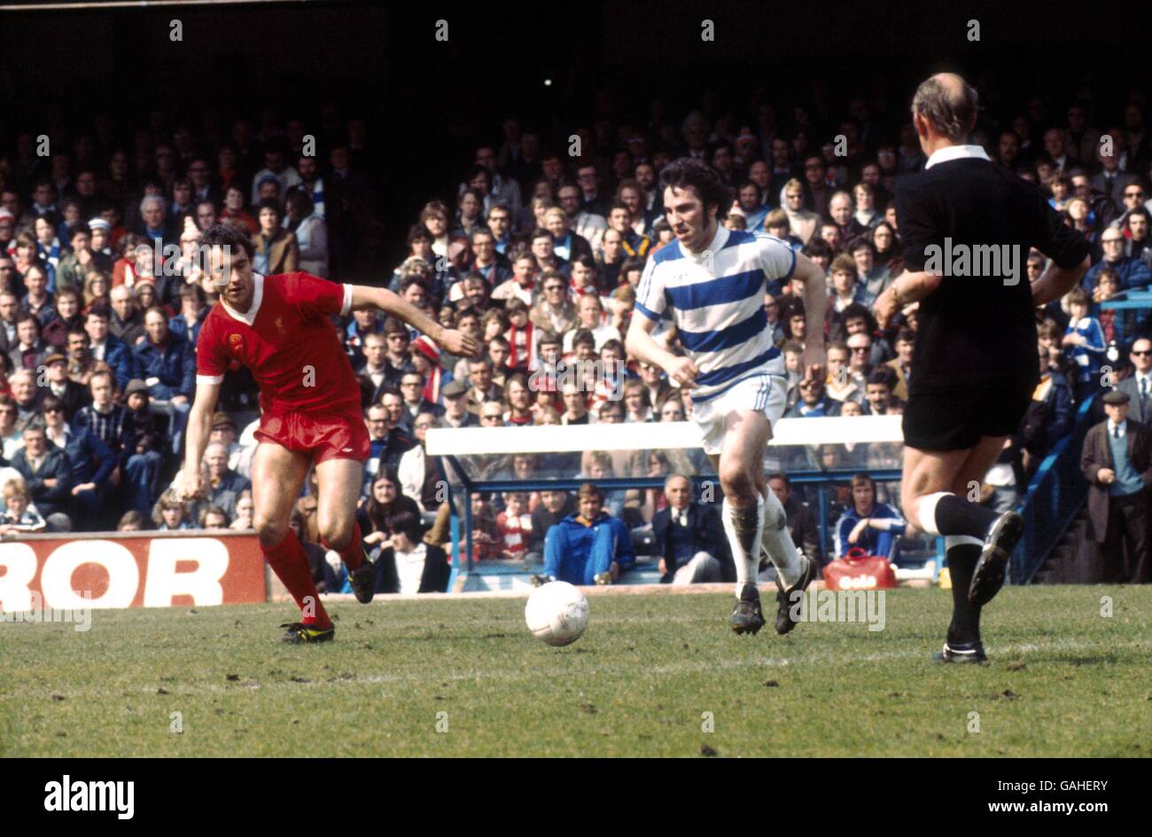 Queens Park Rangers' Gerry Francis (r) looks for a pass as Liverpool's Ray Kennedy (l) closes him down Stock Photo