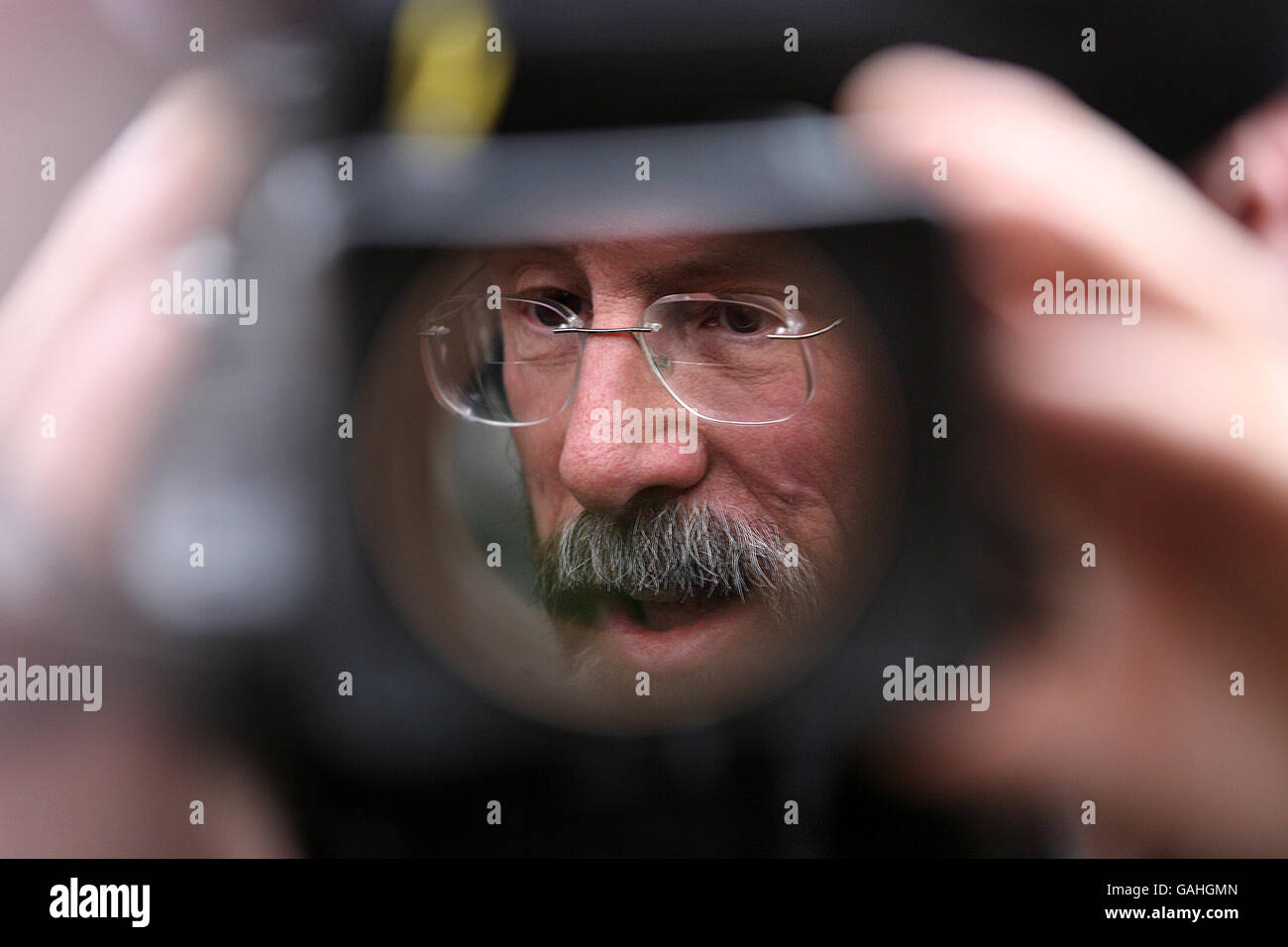 Sinn Fein leader Gerry Adams seen outside Leinster House, in central Dublin, through a TV camera. Stock Photo