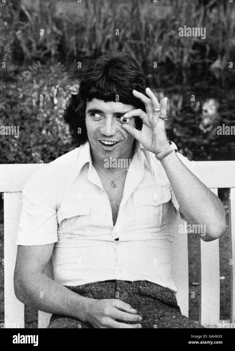 Kevin Keegan, Liverpool and England footballer, holding a false eye in front of his own, during a matching session for Madame Tussauds, in the grounds of a Hertfordshire hotel. Stock Photo