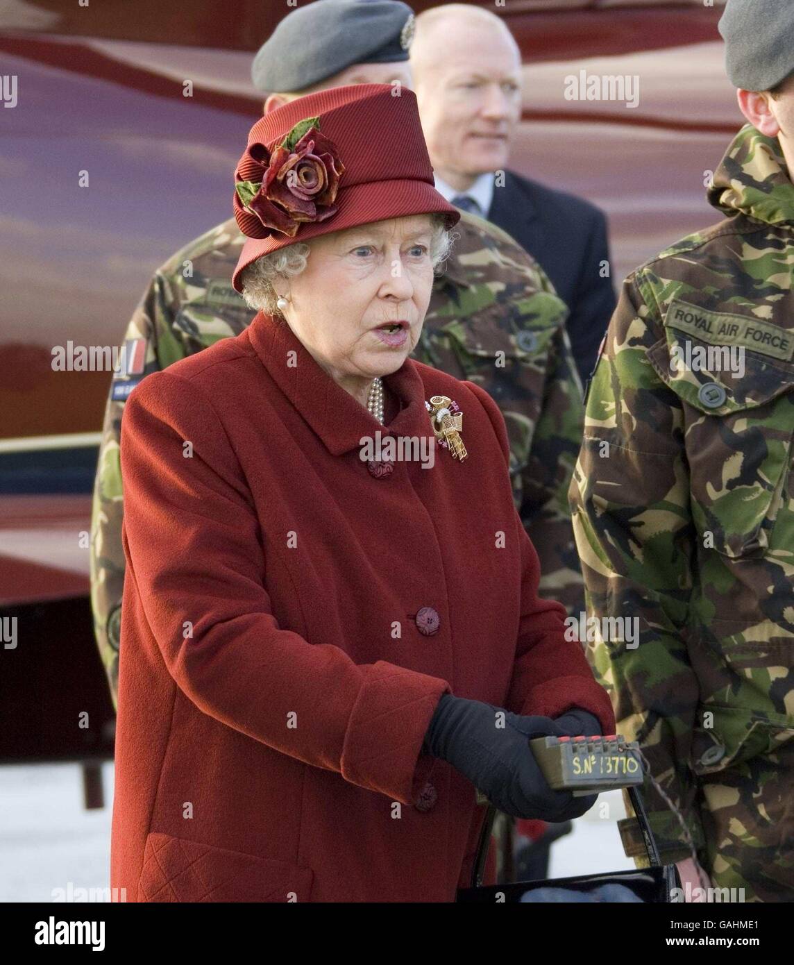 Britain's Queen Elizabeth II detonating an unexploded dummy bomb during her visits the RAF bombing range RAF Holbeach on the Wash in Lincolnshire. Stock Photo