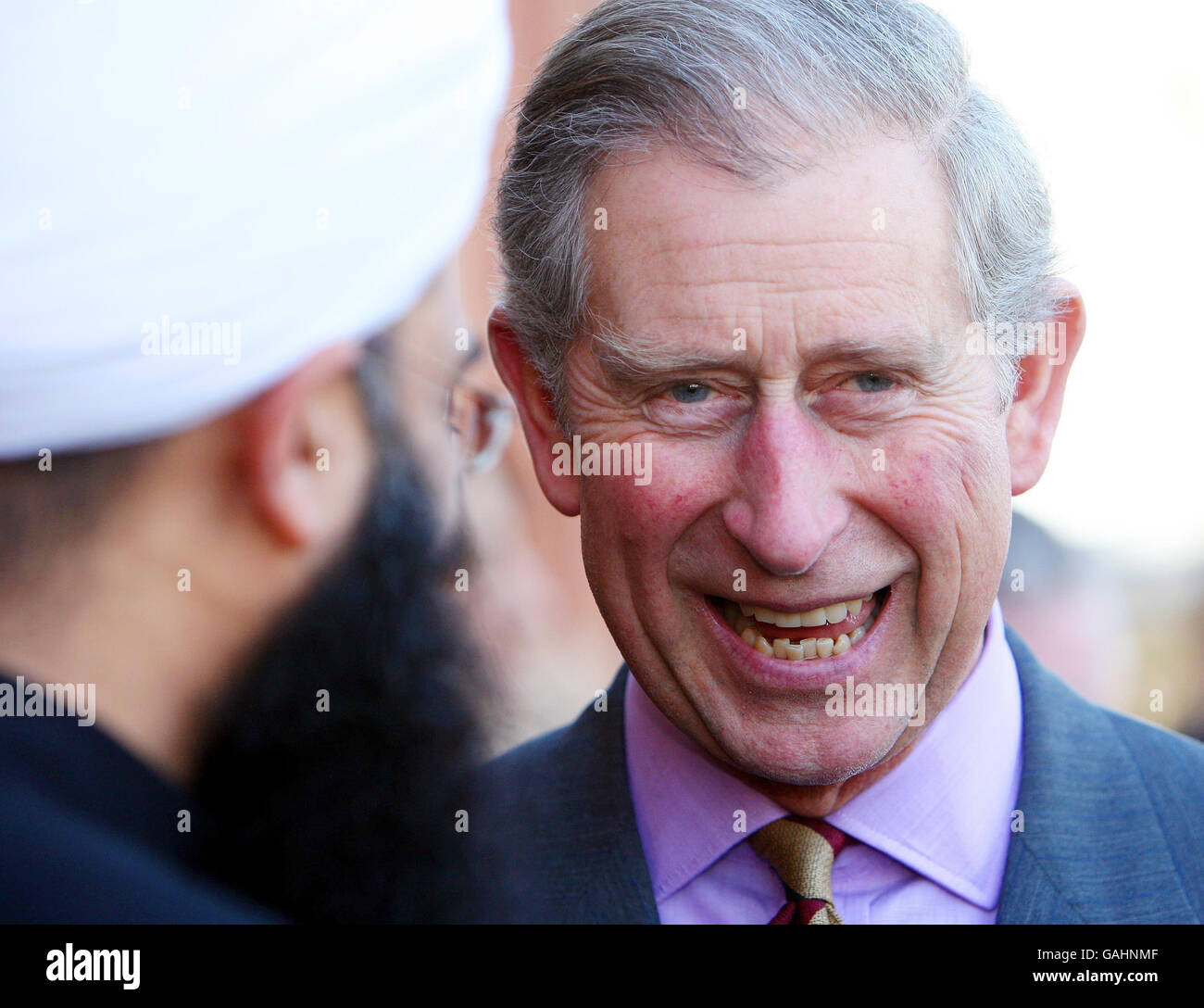 The Prince of Wales talk with members during a visit to St. Philips Interfaith Centre in Leicester. Stock Photo