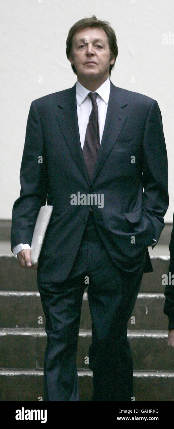 Sir Paul McCartney arrives at the High Court where he is continuing