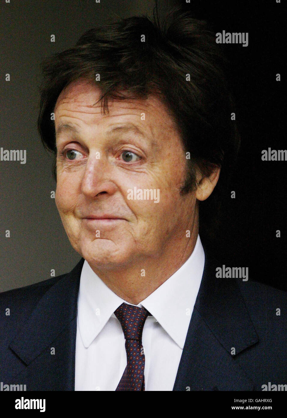 Sir Paul McCartney leaves the High Court at lunchtime where he is