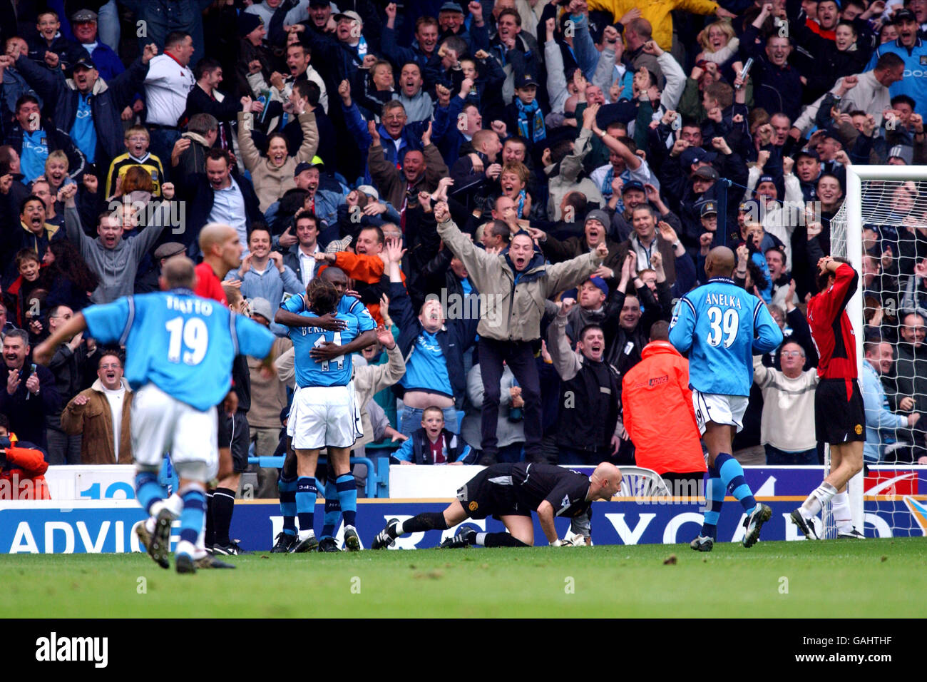 Manchester City S Shaun Goater Scorer Of Their Second Goal Is Congratulated By Eyal Berkovic As Manchester United S Juan Veron Fabien Barthez And Laurent Blanc Turn Away Dejected Stock Photo Alamy