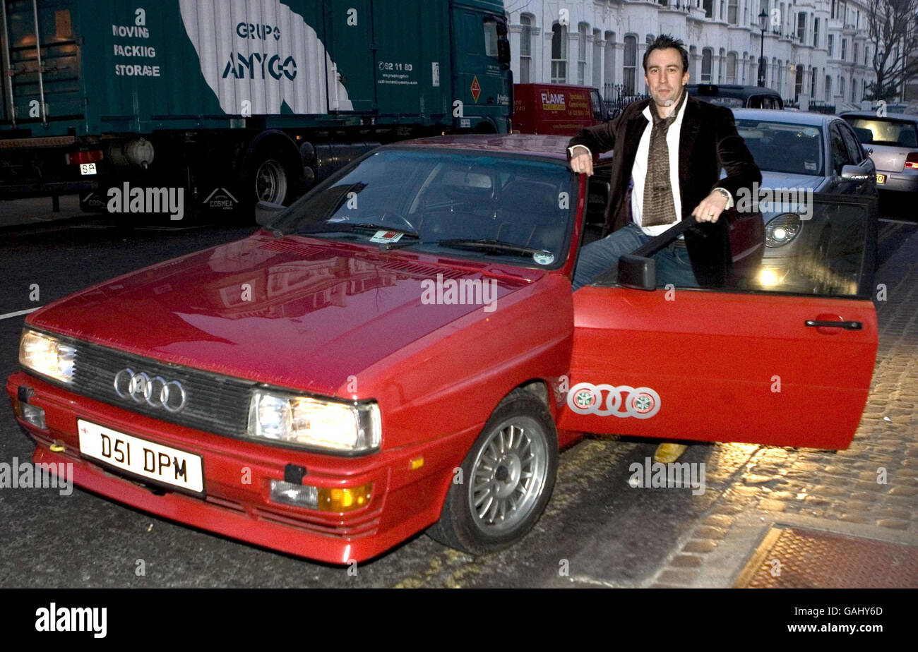 Virgin Radio disc jockey Christian O'Connell arrives at the Brit Awards Ceremony in a red Audi Quattro, similar to the one driven by DCI Gene Hunt in the TV series Ashes to Ashes, Earls Court, London. Stock Photo