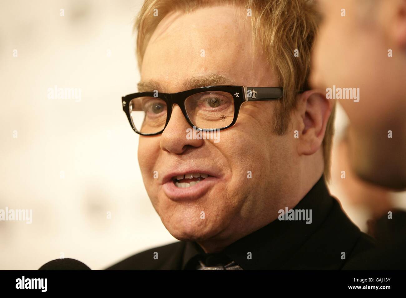 Elton John arrives for the 16th Annual Sir Elton John AIDS Foundation Oscar Party at the Pacific Design Centre in Los Angeles. Stock Photo